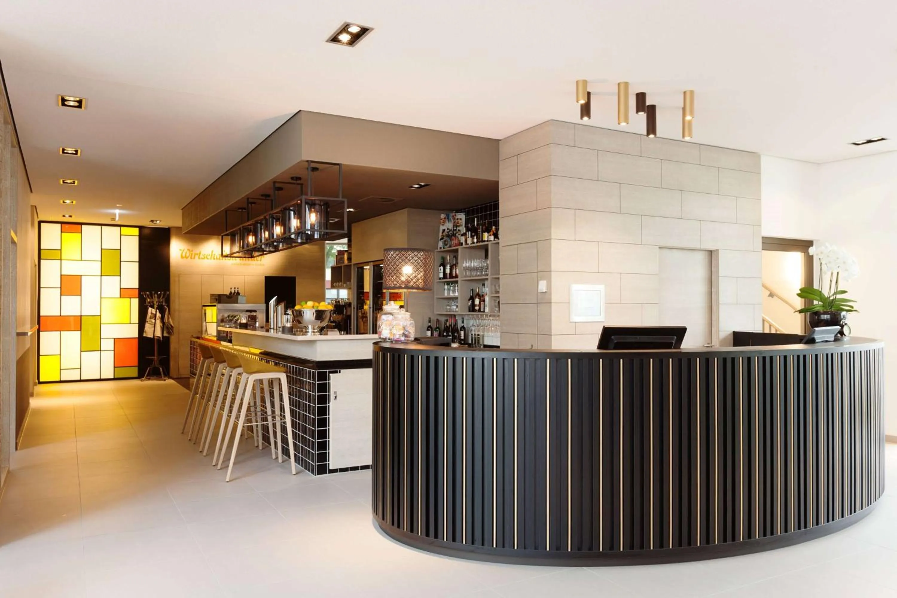 Lobby or reception in Vienna House Easy by Wyndham Osnabrück City & Apartments