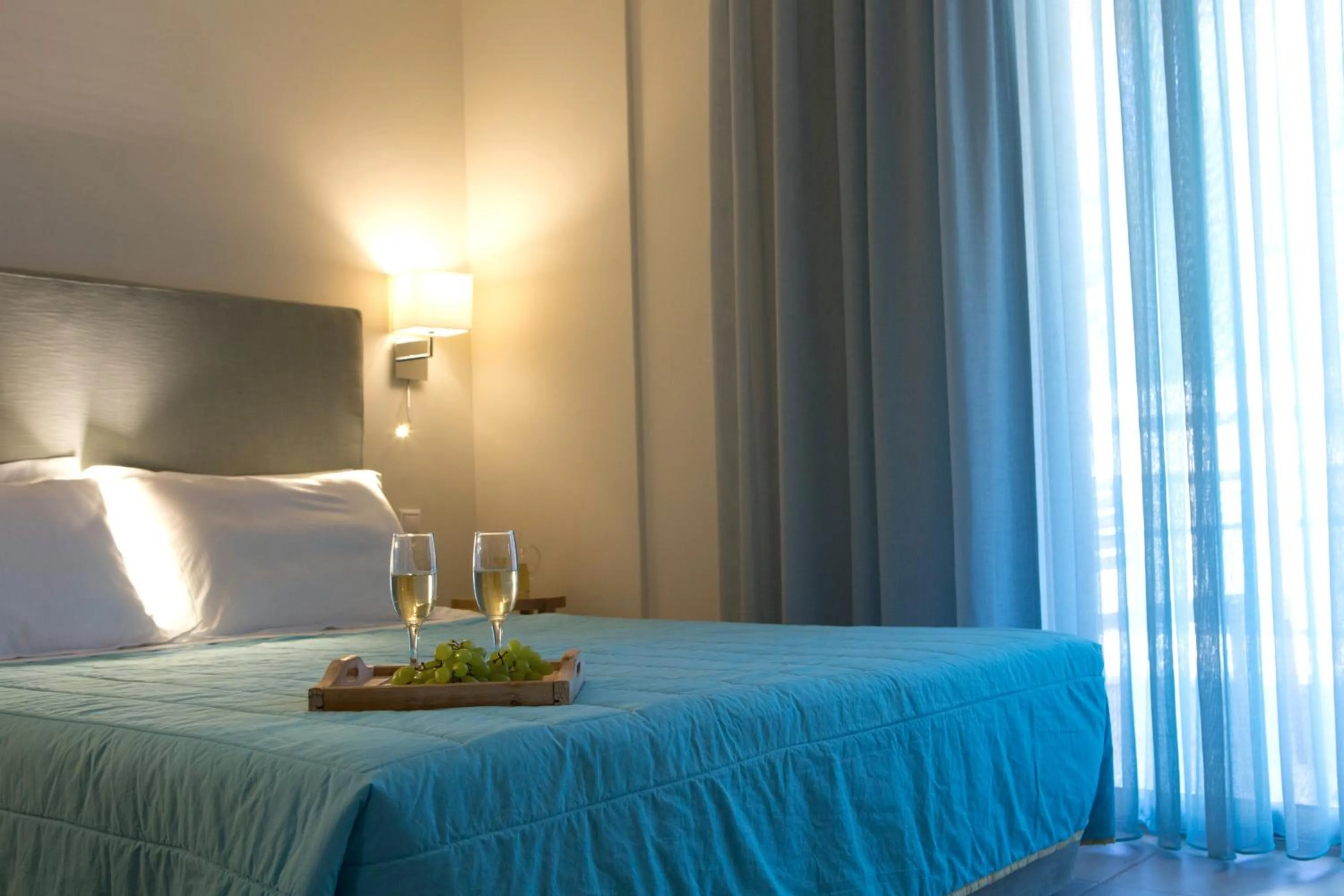 Bed in Grand TheoNi Boutique Hotel & Spa