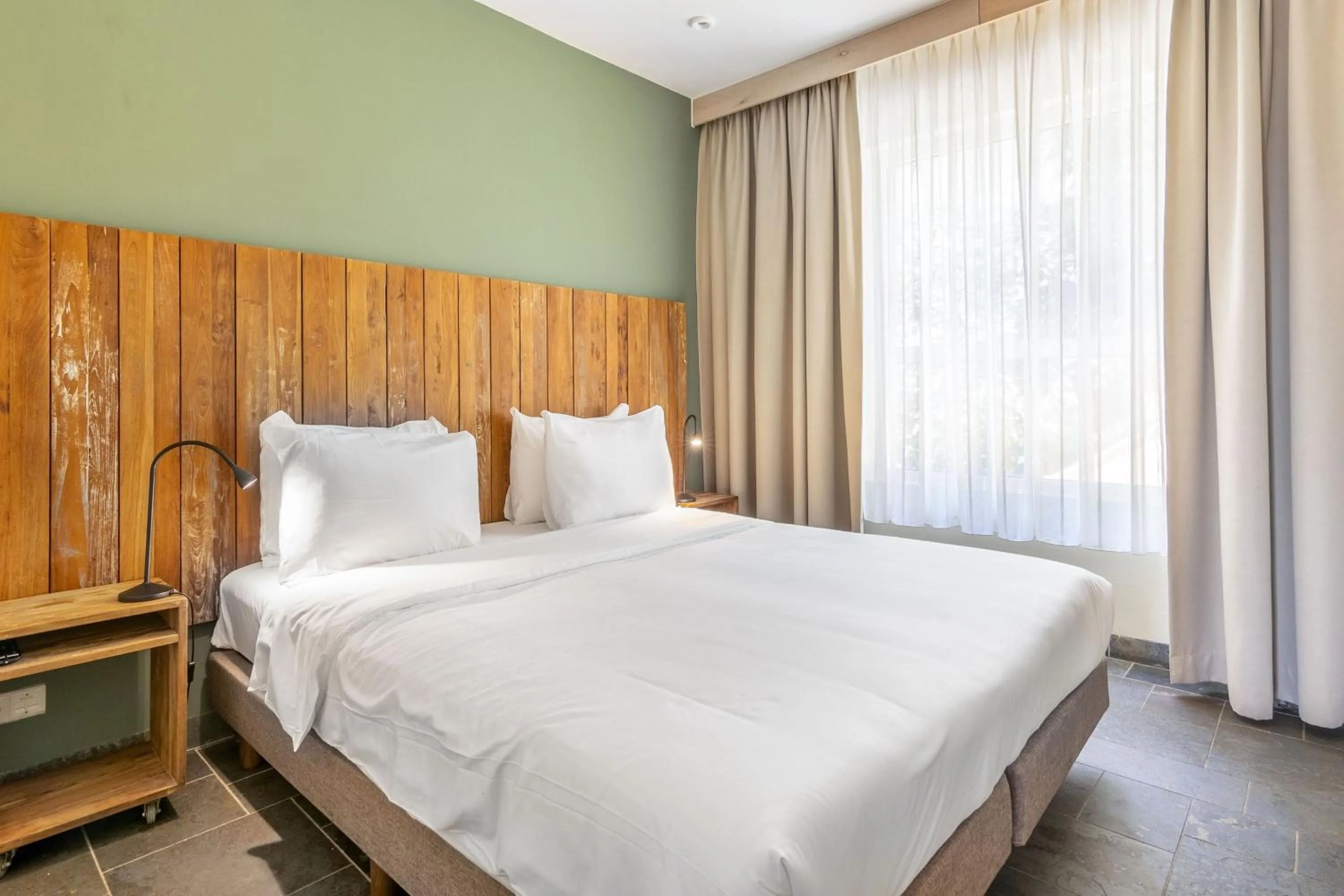 Bed in Bayside Boutique Hotel - Blue Bay Golf & Beach Resort