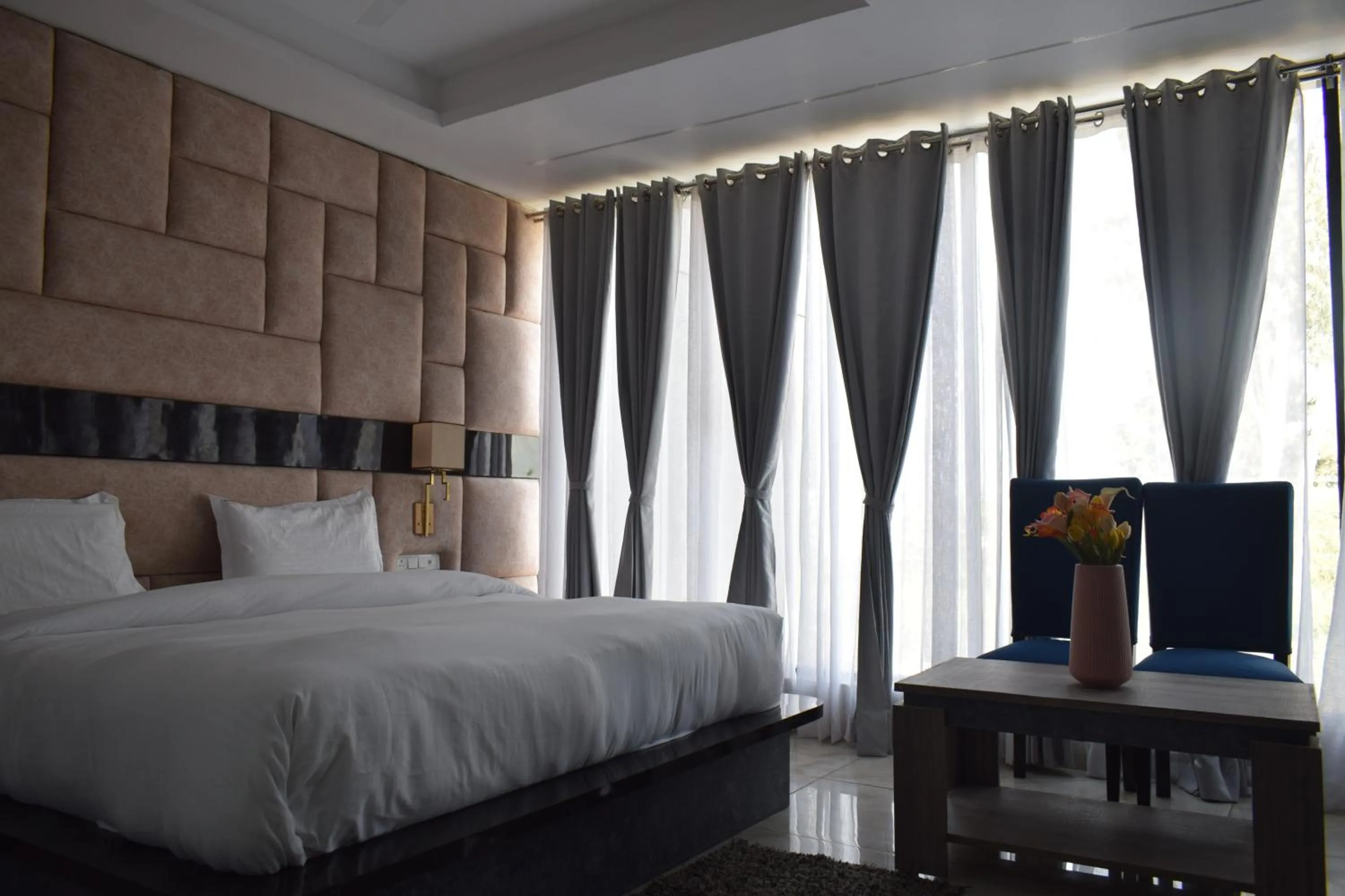 Bedroom, Bed in Country Ambience Hotel By Jags City Mall