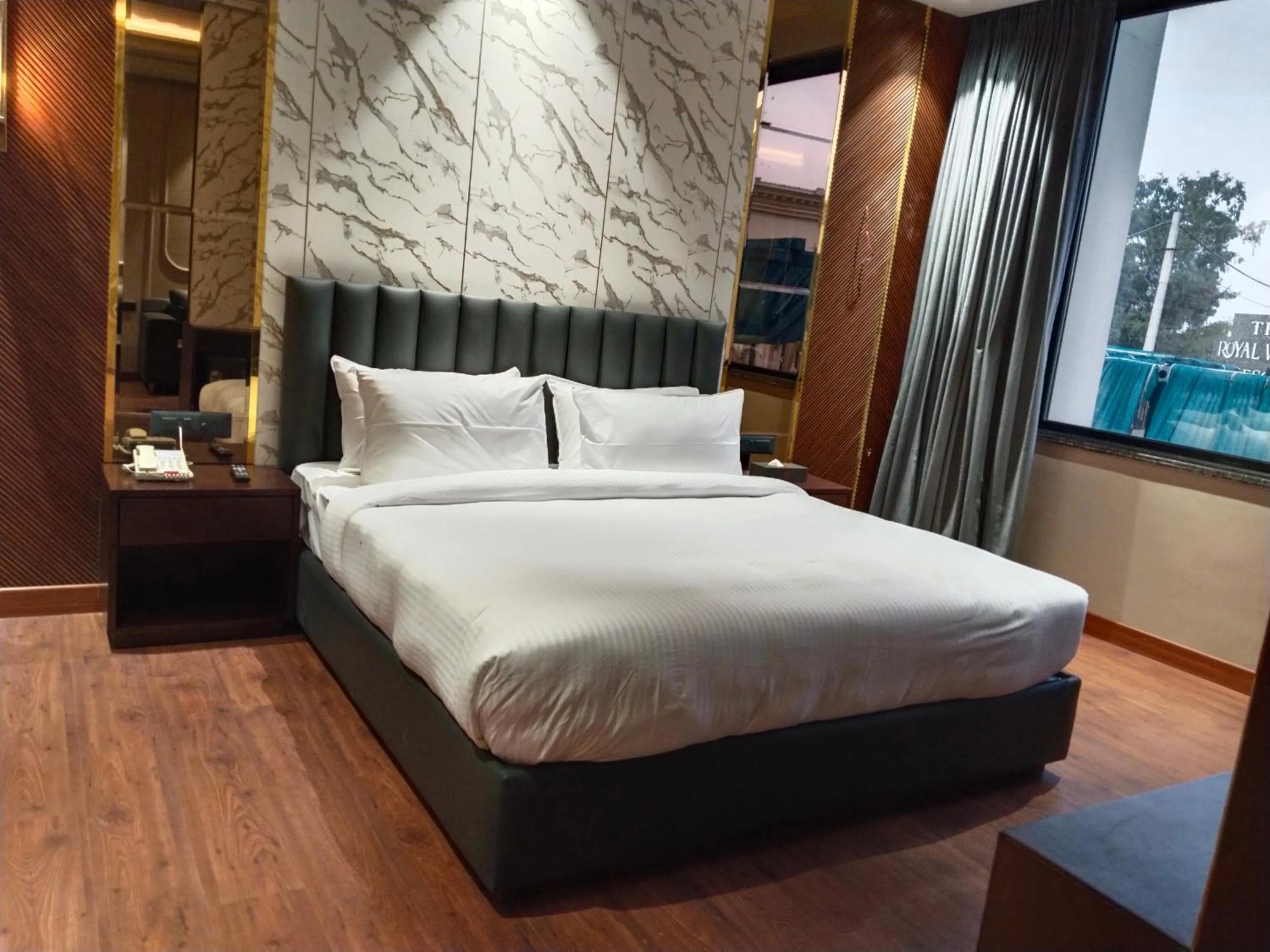 Bed in The Royal Velvet Hotel & Resort