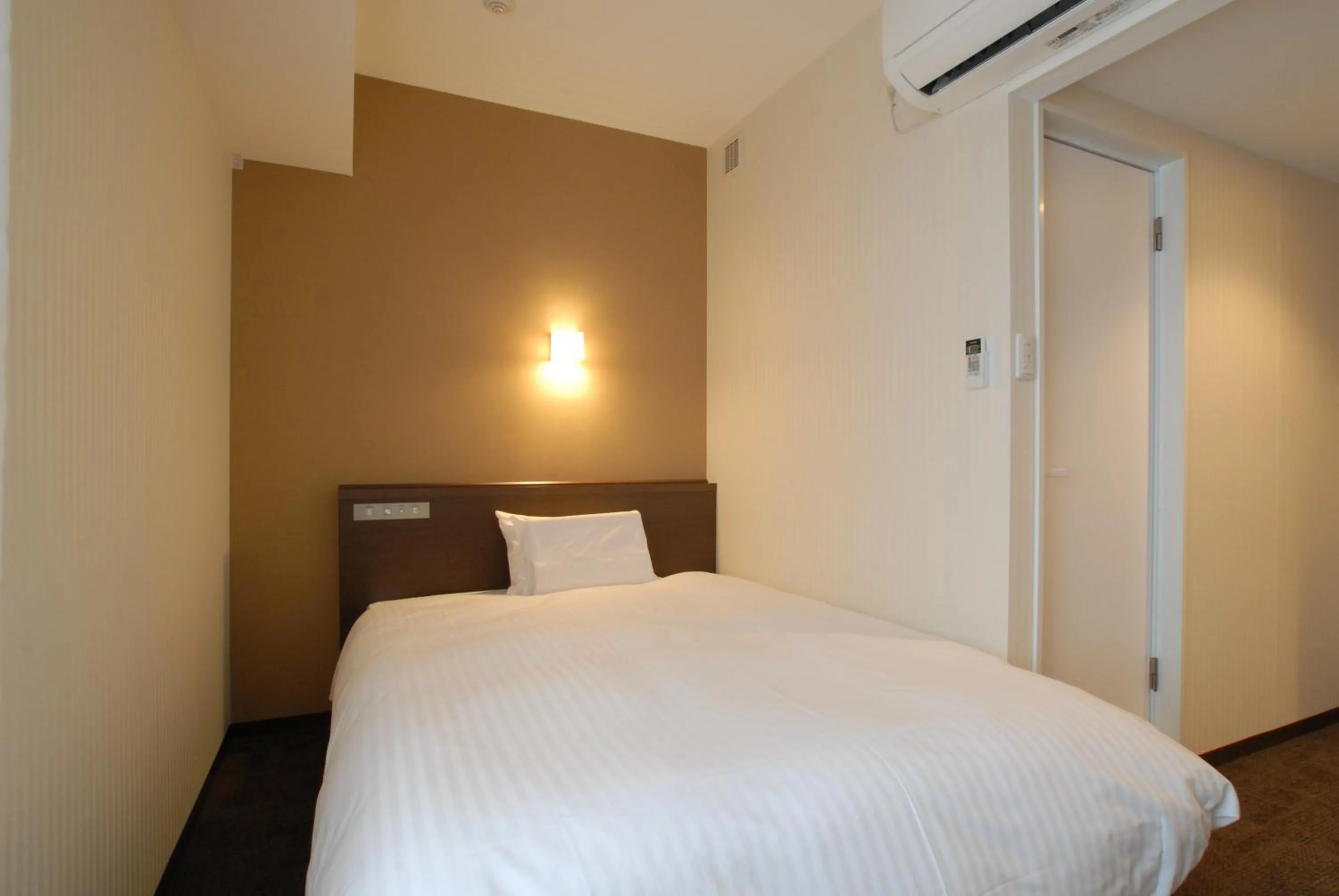 Bed in AB Hotel Kanazawa