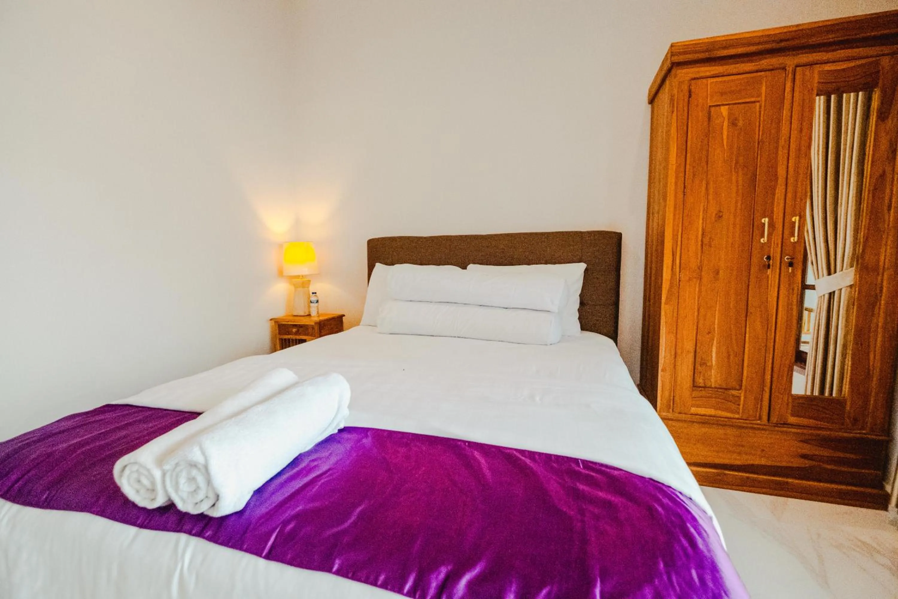 Bed in Turtle Shelter Guest House