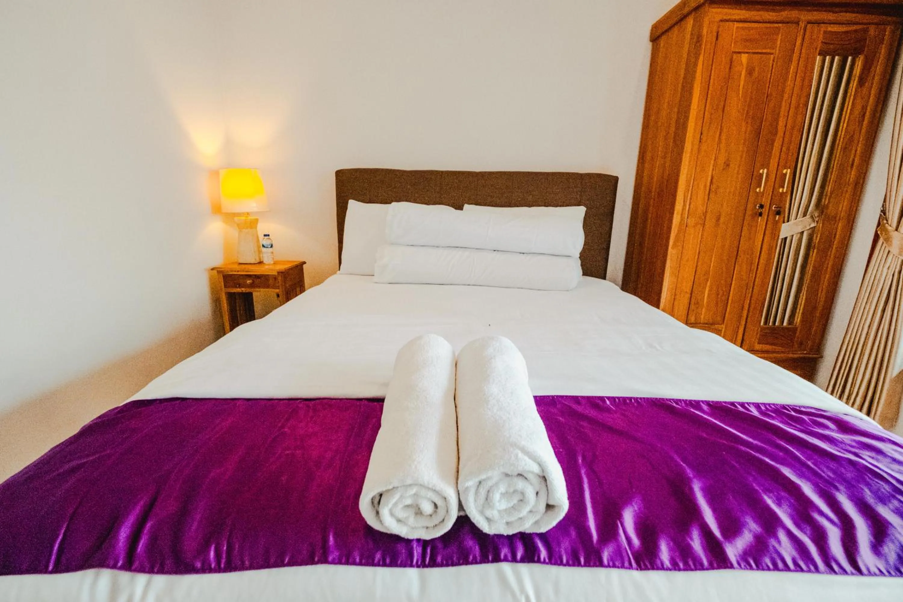 Bed in Turtle Shelter Guest House