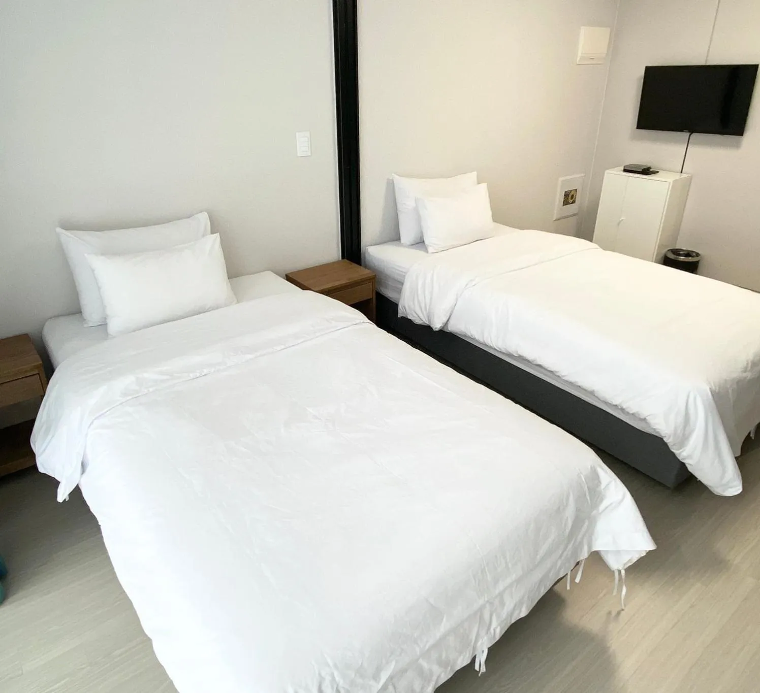 Bed in Grand Bleu Hotel & Residence