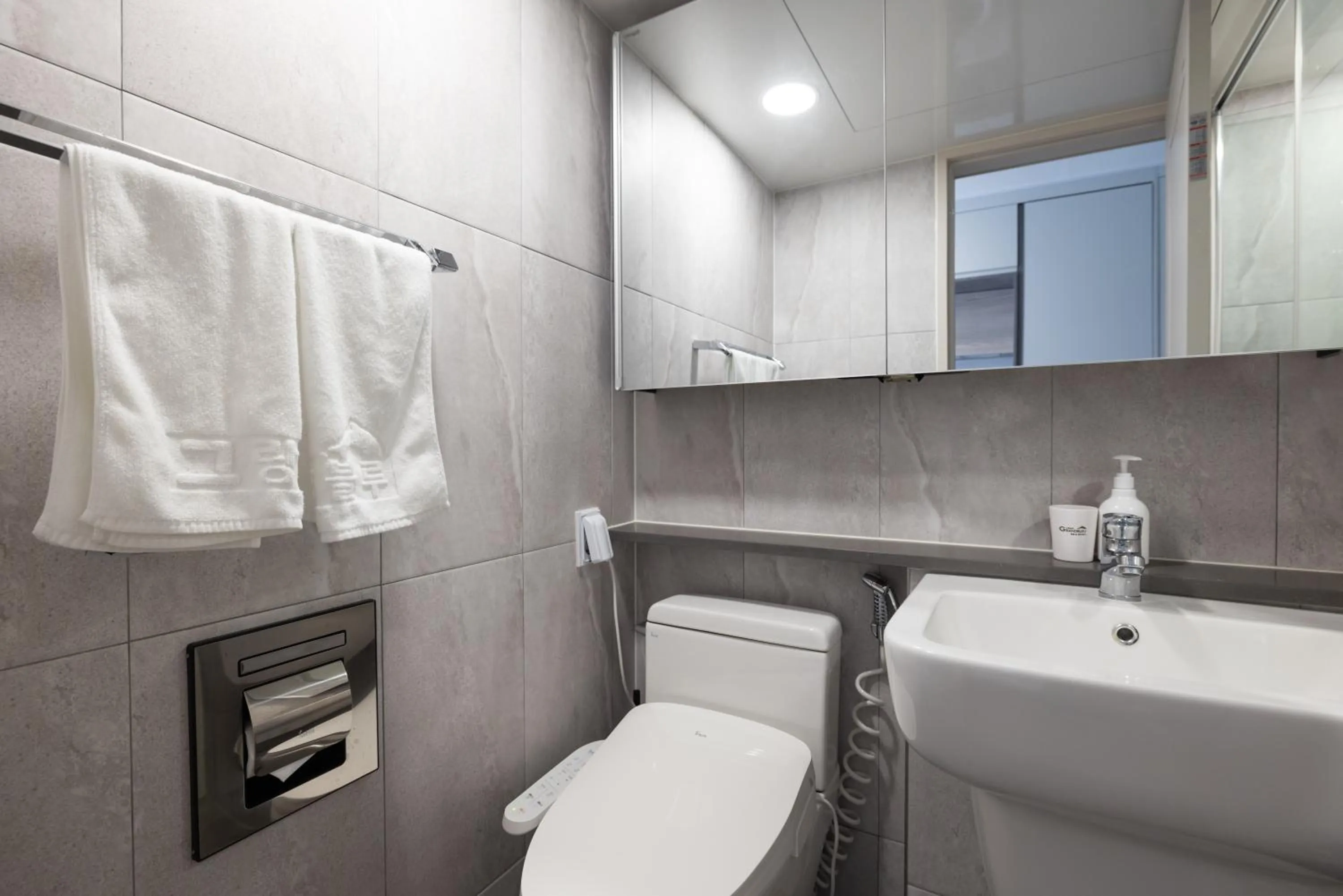 Toilet in Grand Bleu Hotel & Residence