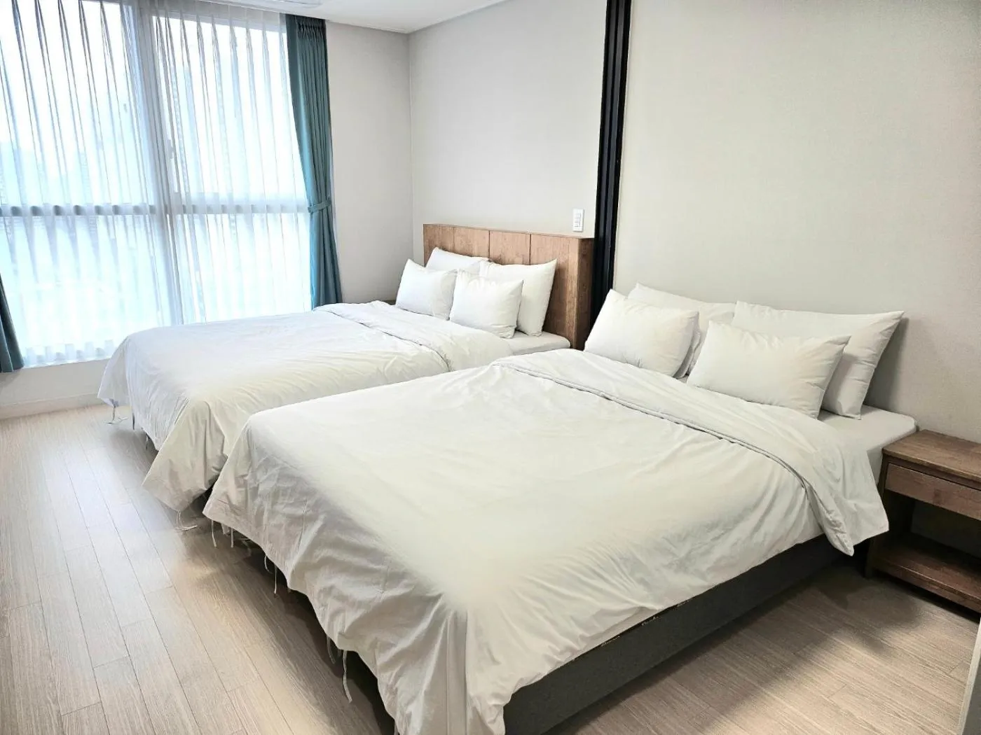 Bed in Grand Bleu Hotel & Residence