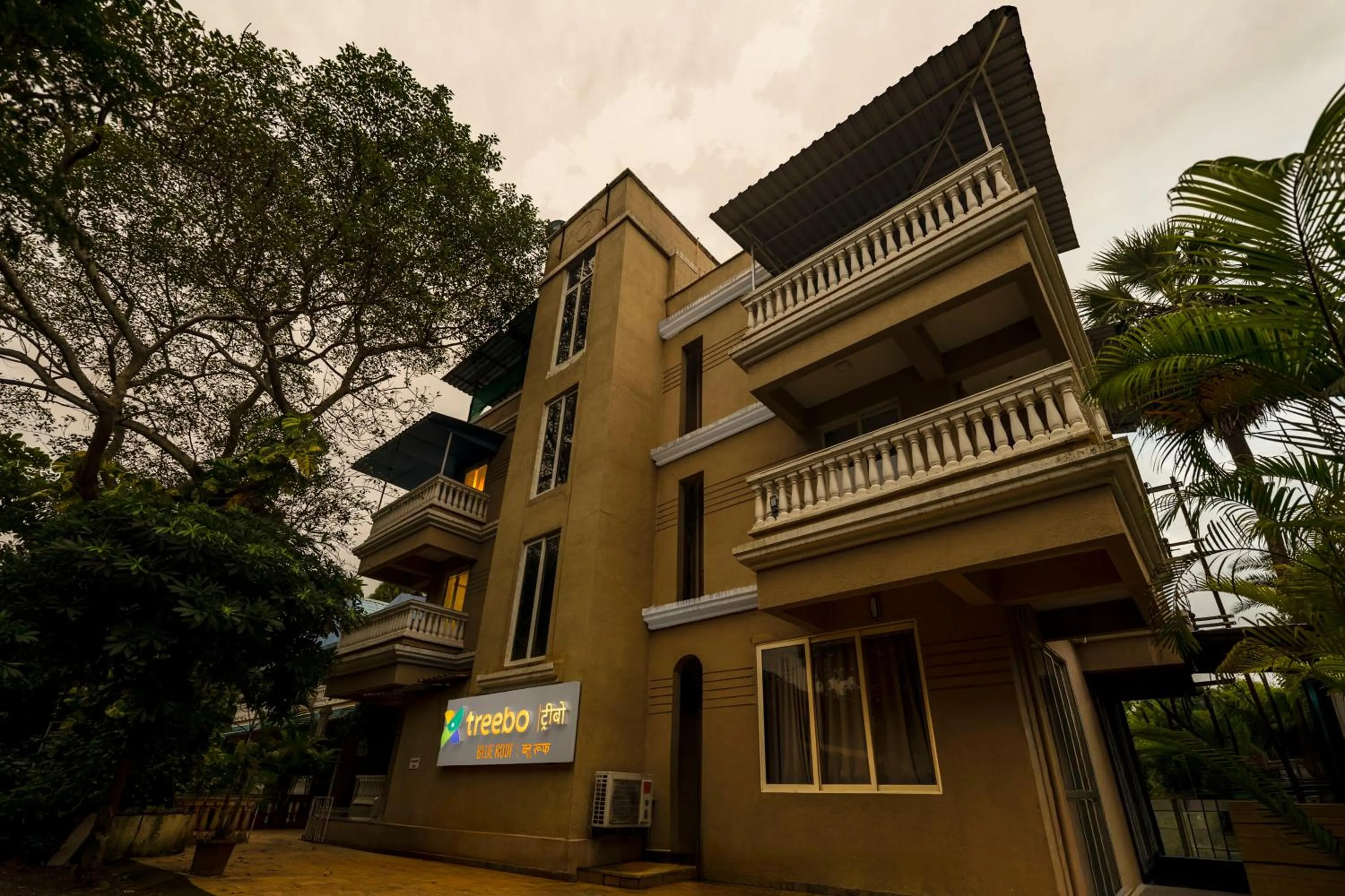 Property building in Treebo Blue Roof, Kelwa