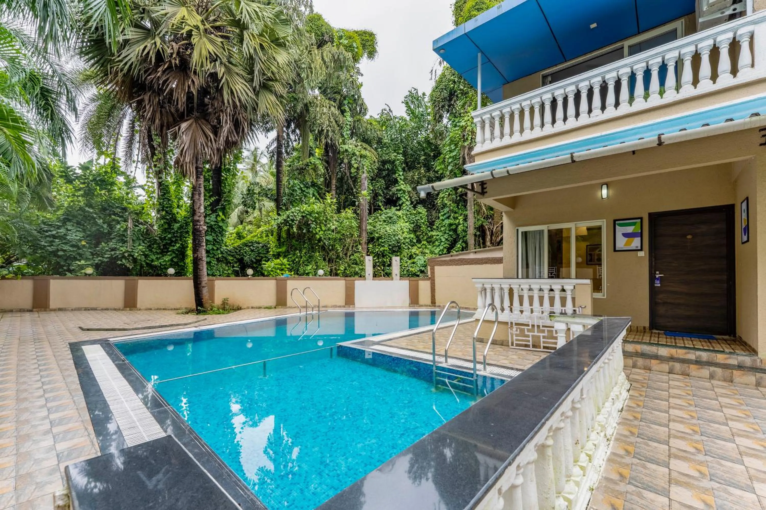 Swimming pool in Treebo Blue Roof, Kelwa