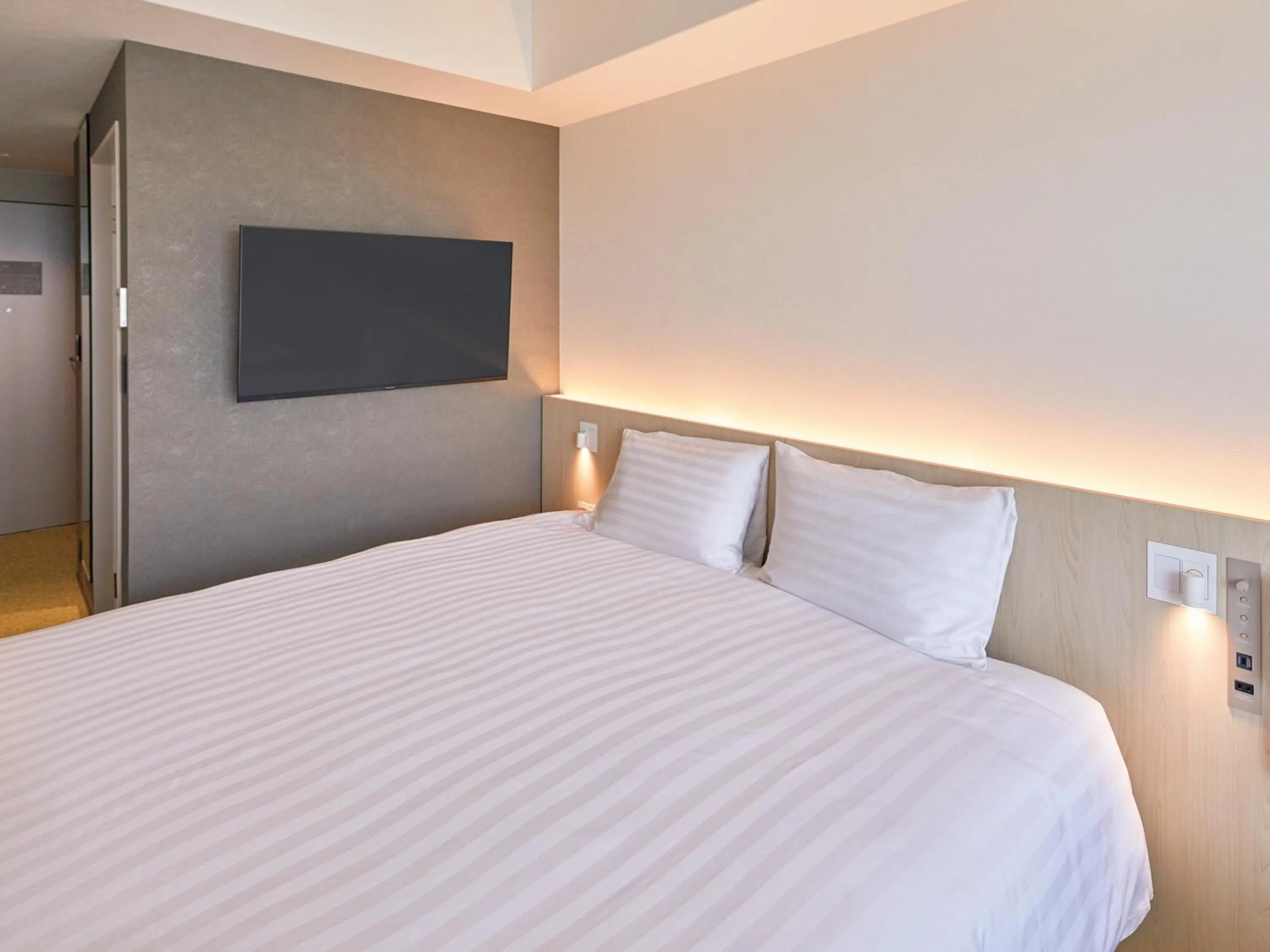 Bed in Dorsett by Agora Osaka Sakai