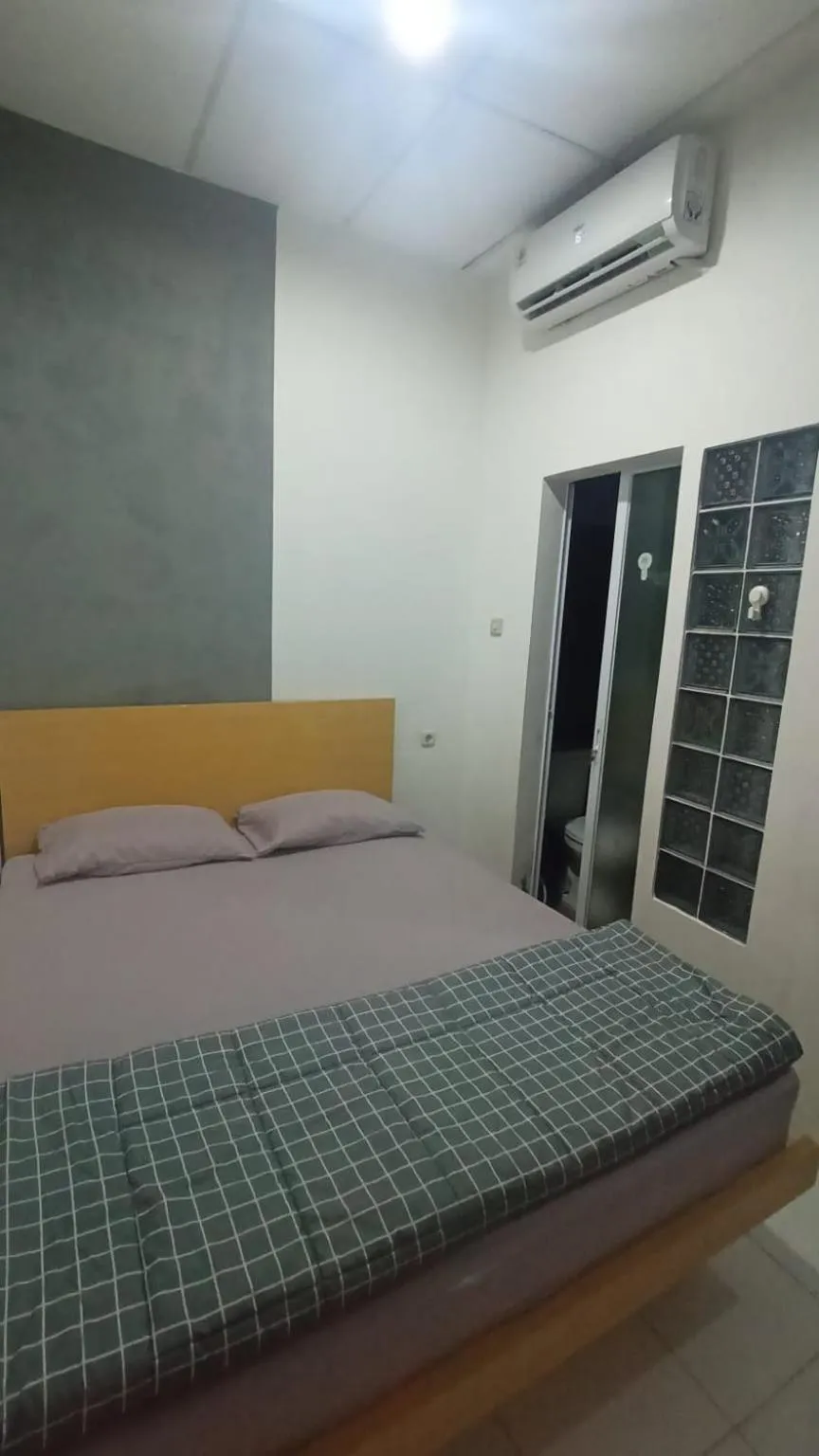 Bed in Behomy Cibinong Suite