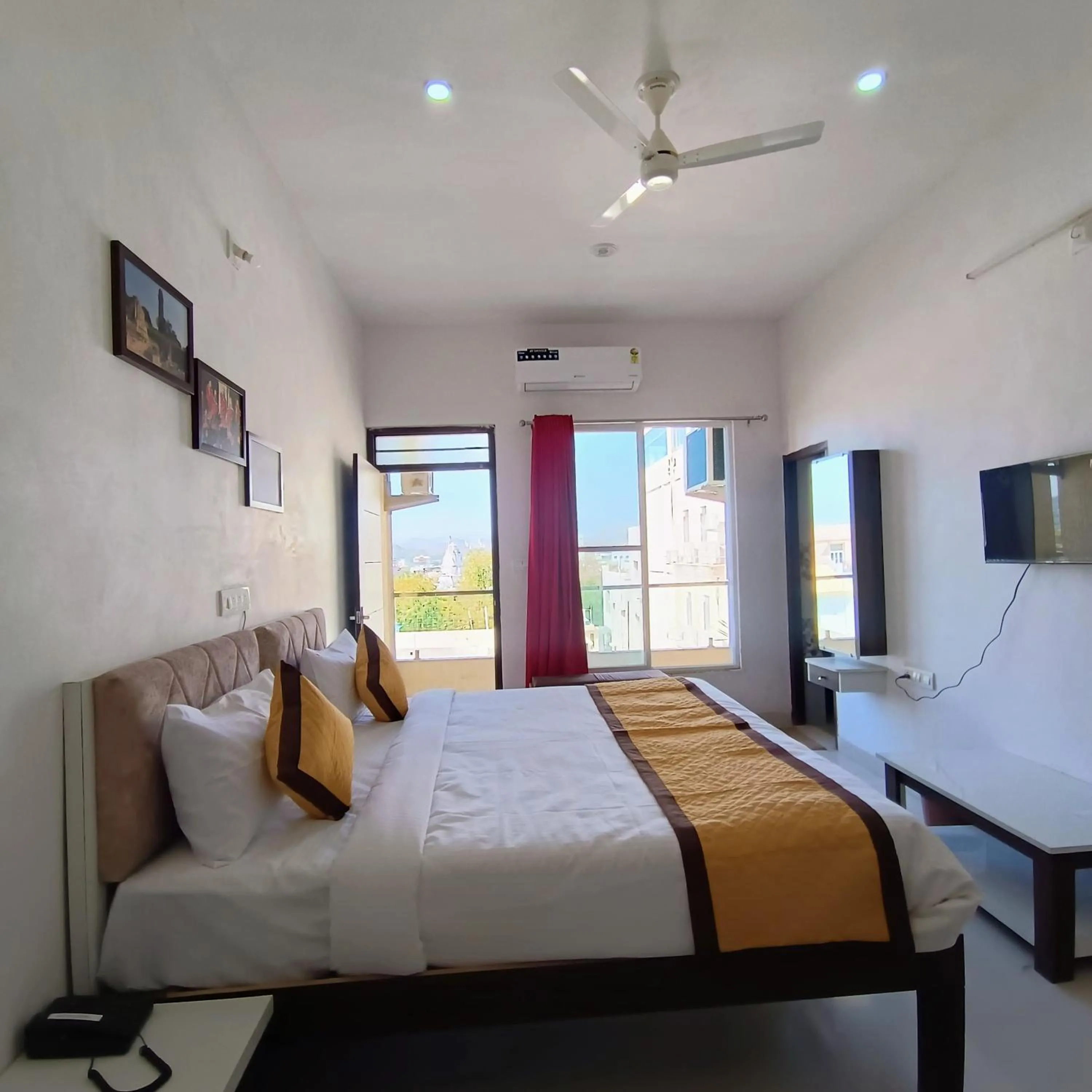 Bed in Arul's Hotel