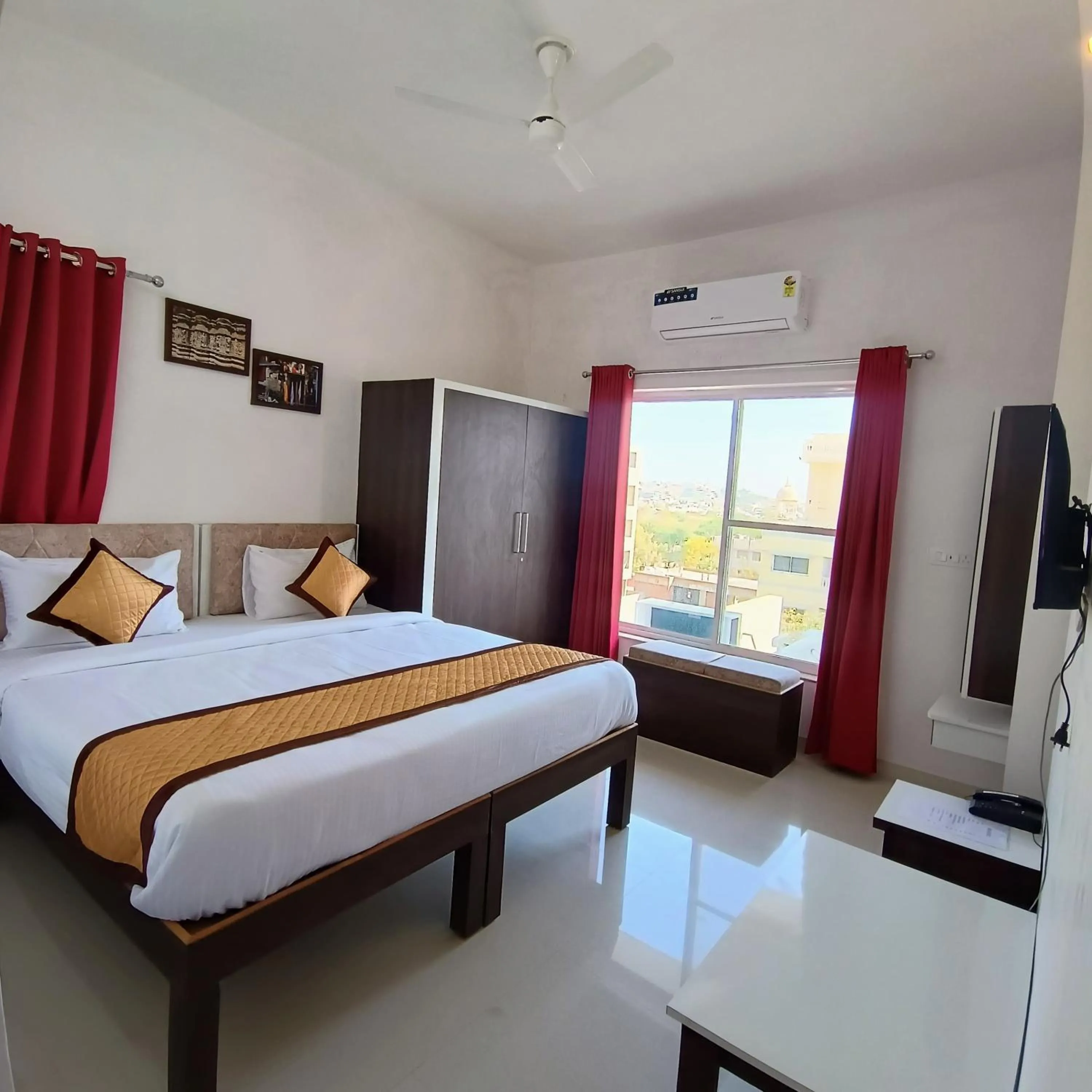 Bed in Arul's Hotel