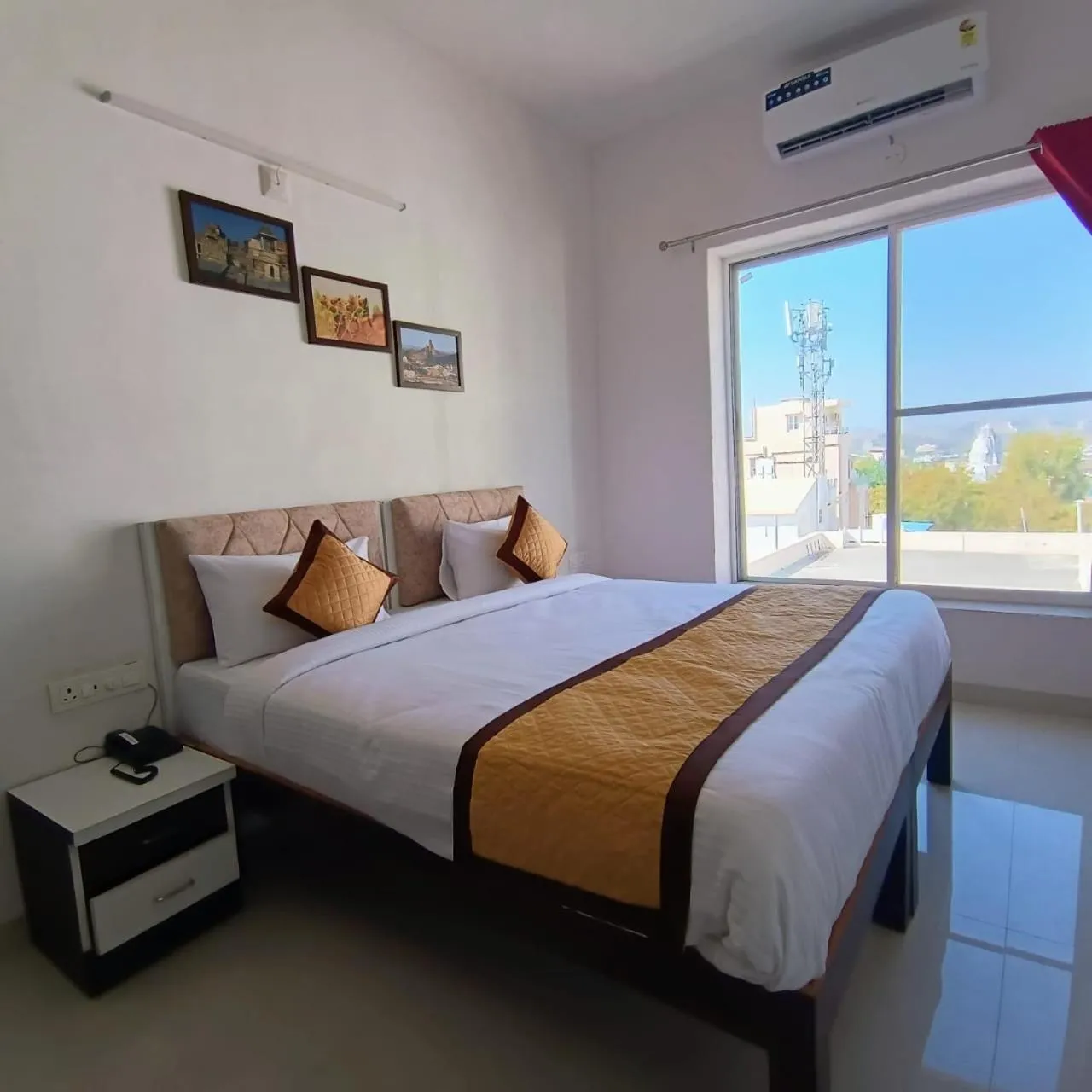 Bed in Arul's Hotel