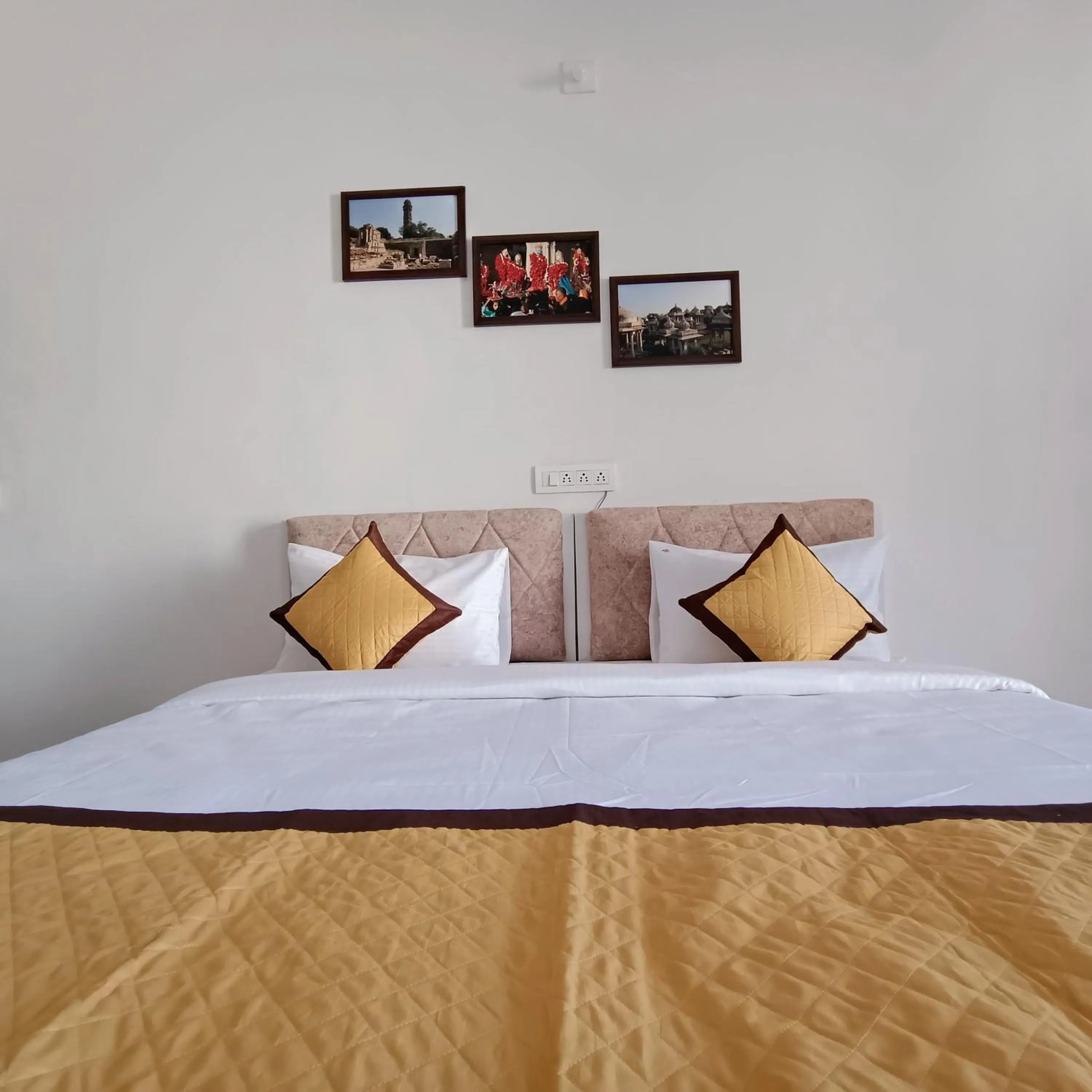 Bed in Arul's Hotel