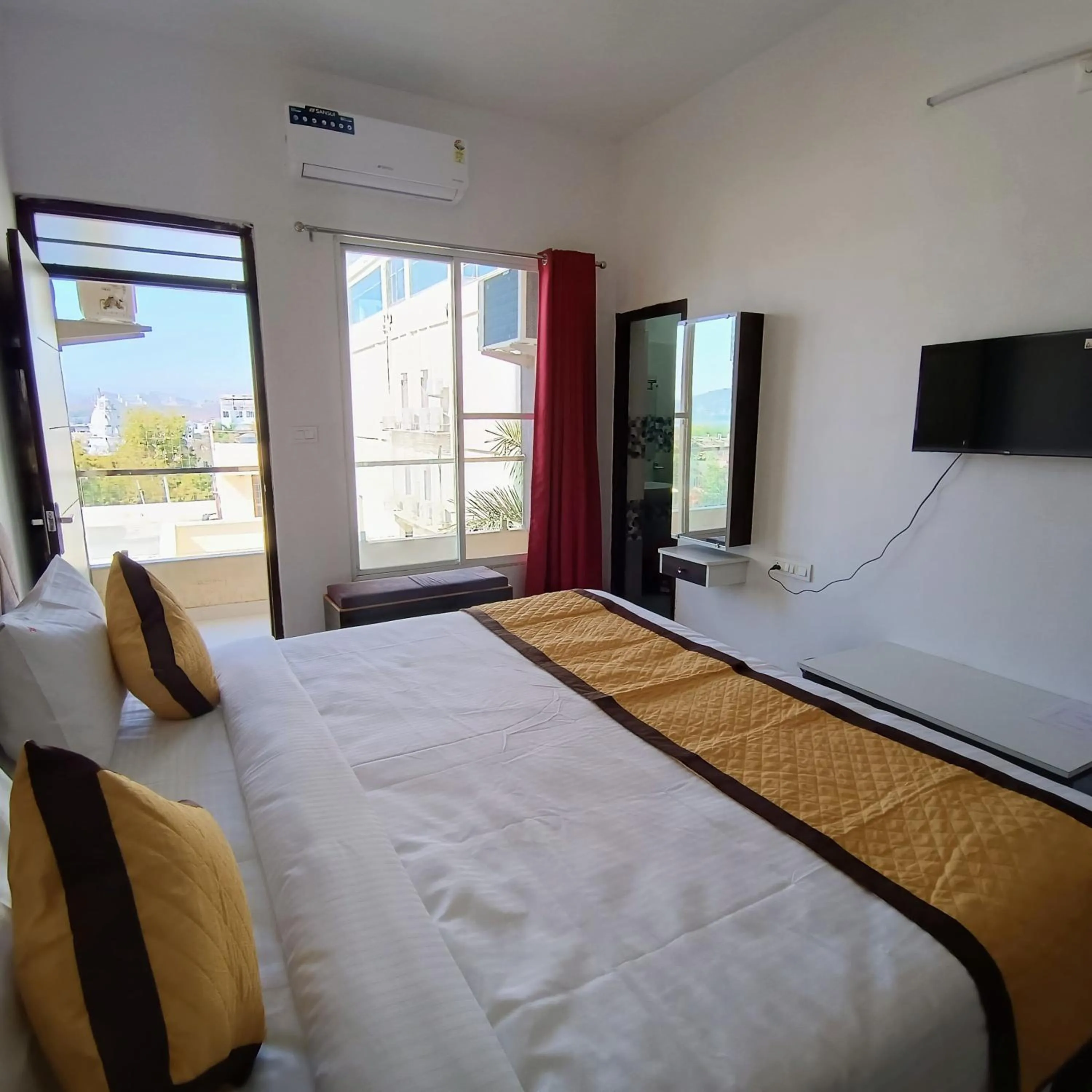 Bed in Arul's Hotel