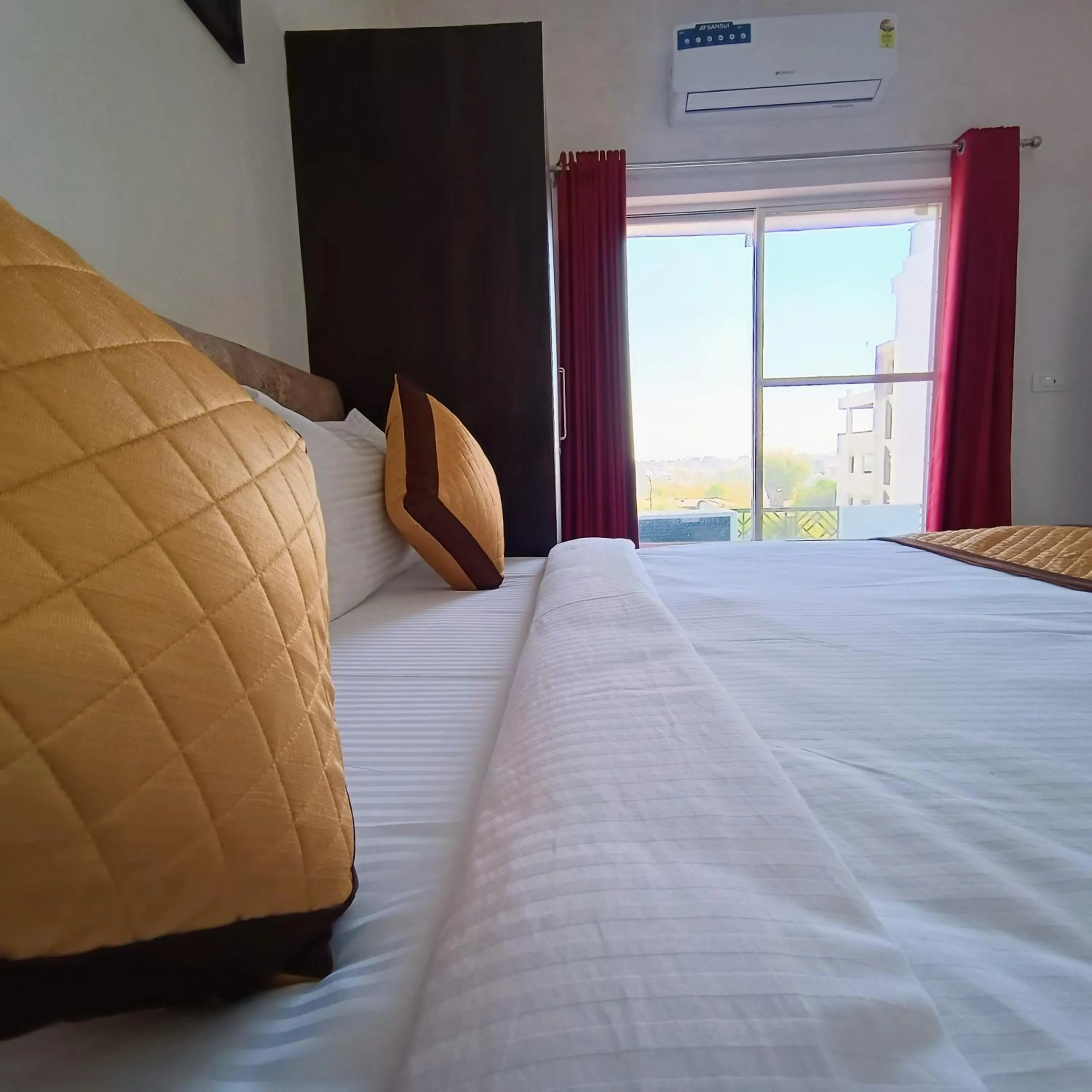 Bed in Arul's Hotel