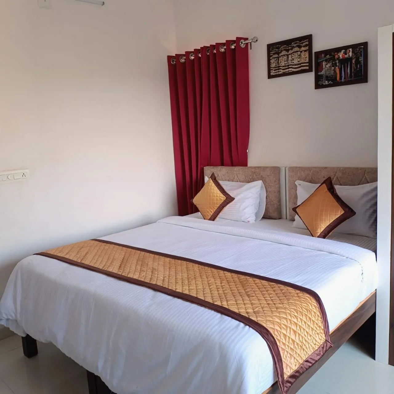 Bed in Arul's Hotel