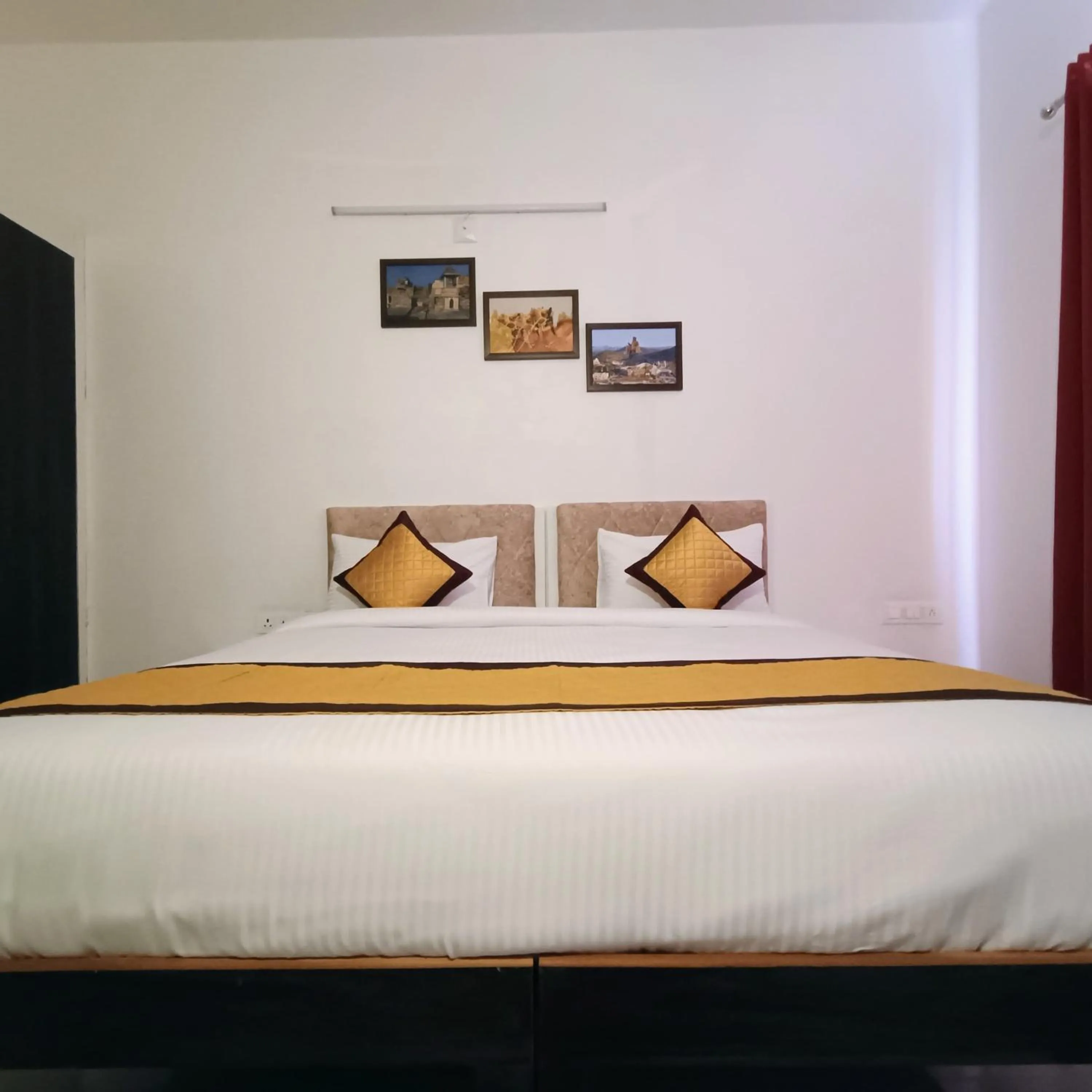 Bed in Arul's Hotel