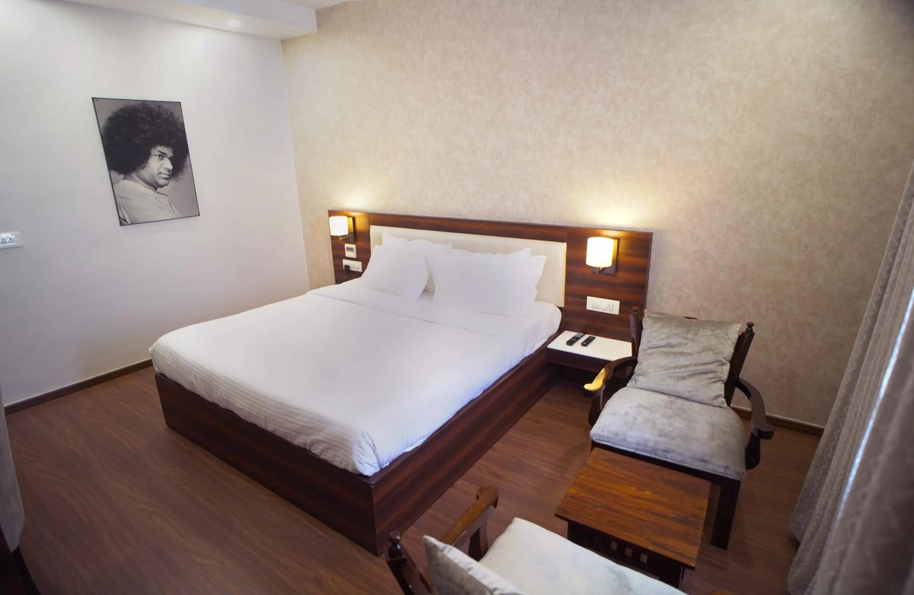 Photo of the whole room, Bed in Sai Maa Hotel & Residency