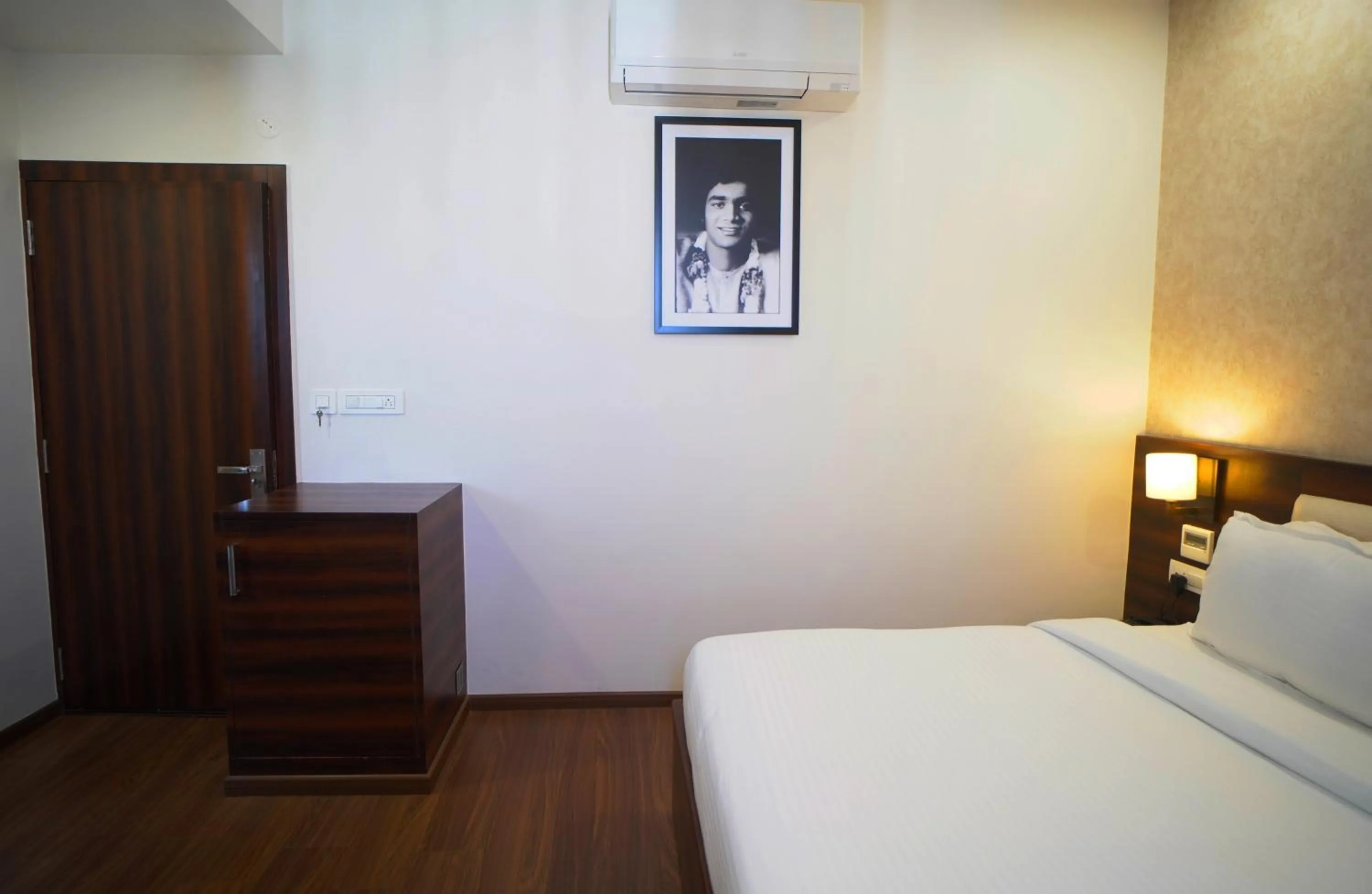 Photo of the whole room, Bed in Sai Maa Hotel & Residency