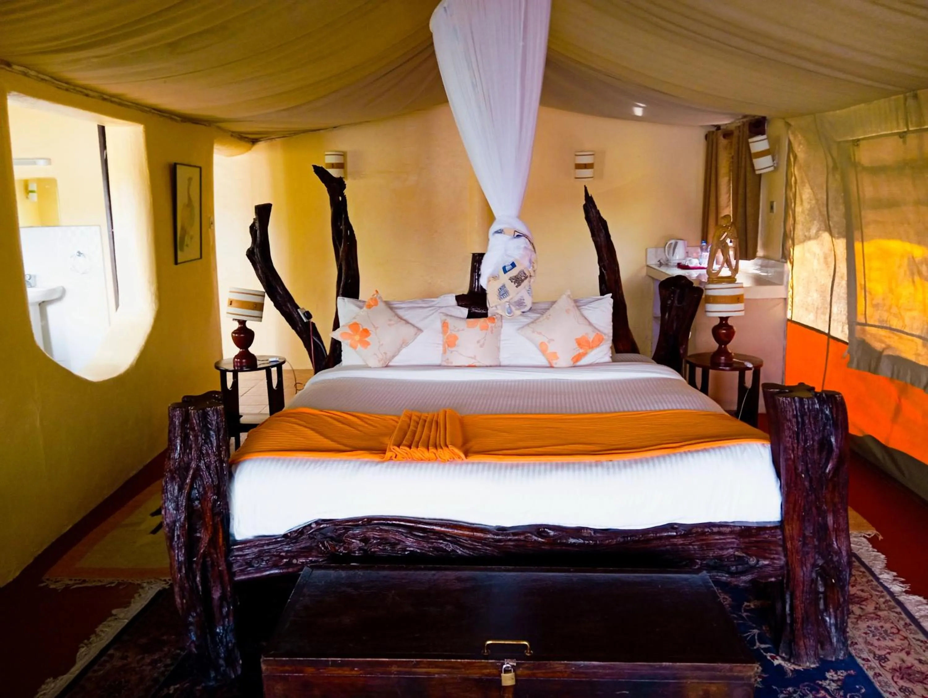 Bed in Crater Lake Tented Camp And Game Sanctuary