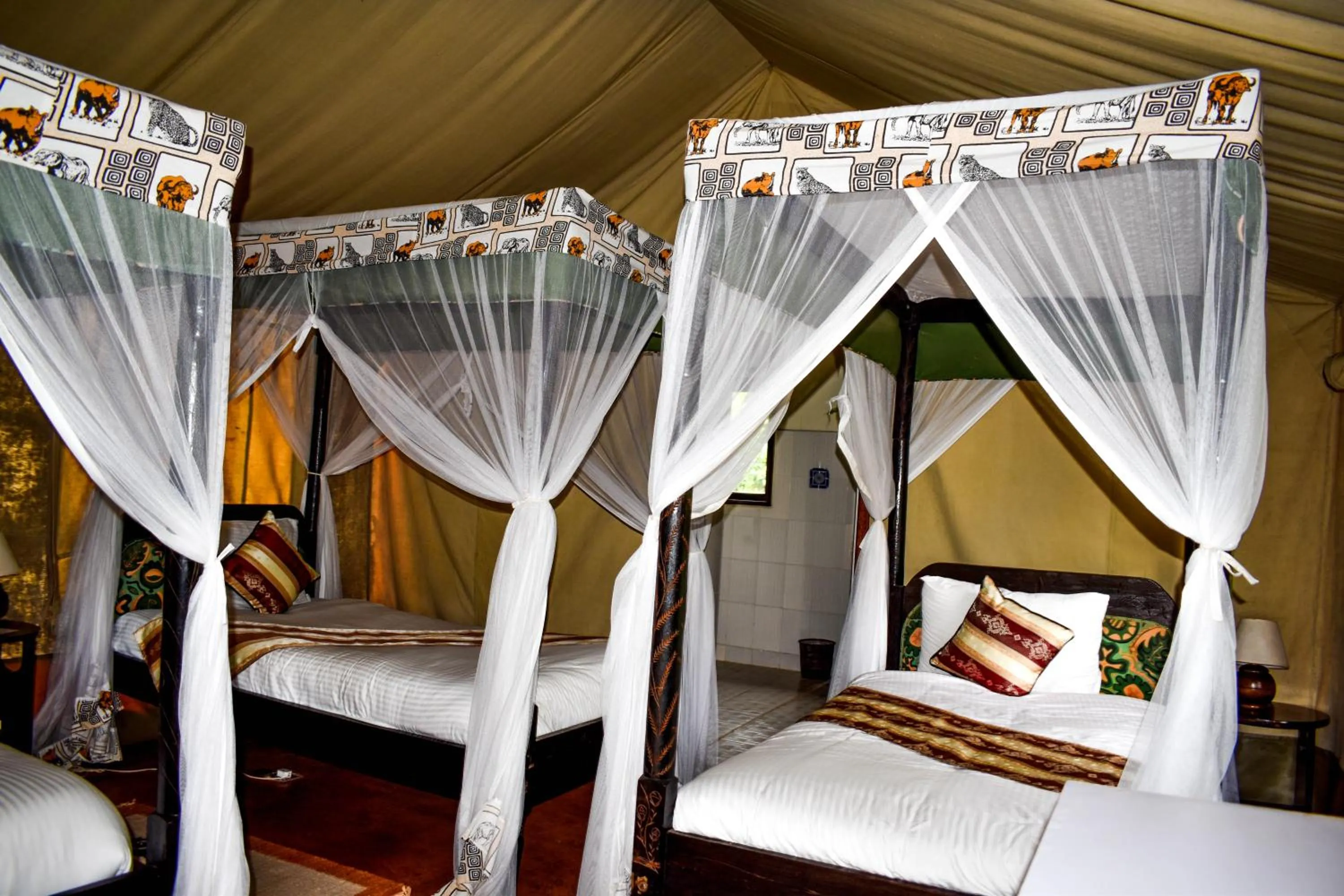 Bed in Crater Lake Tented Camp And Game Sanctuary
