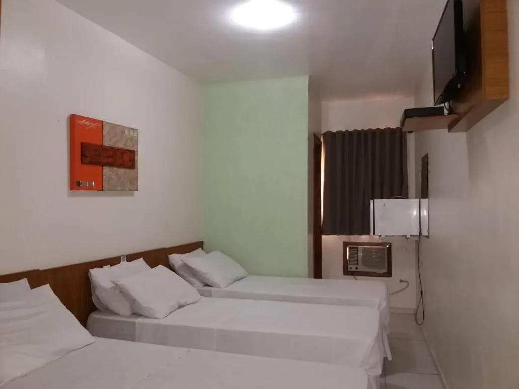 Bed in Ipê Guaru Hotel