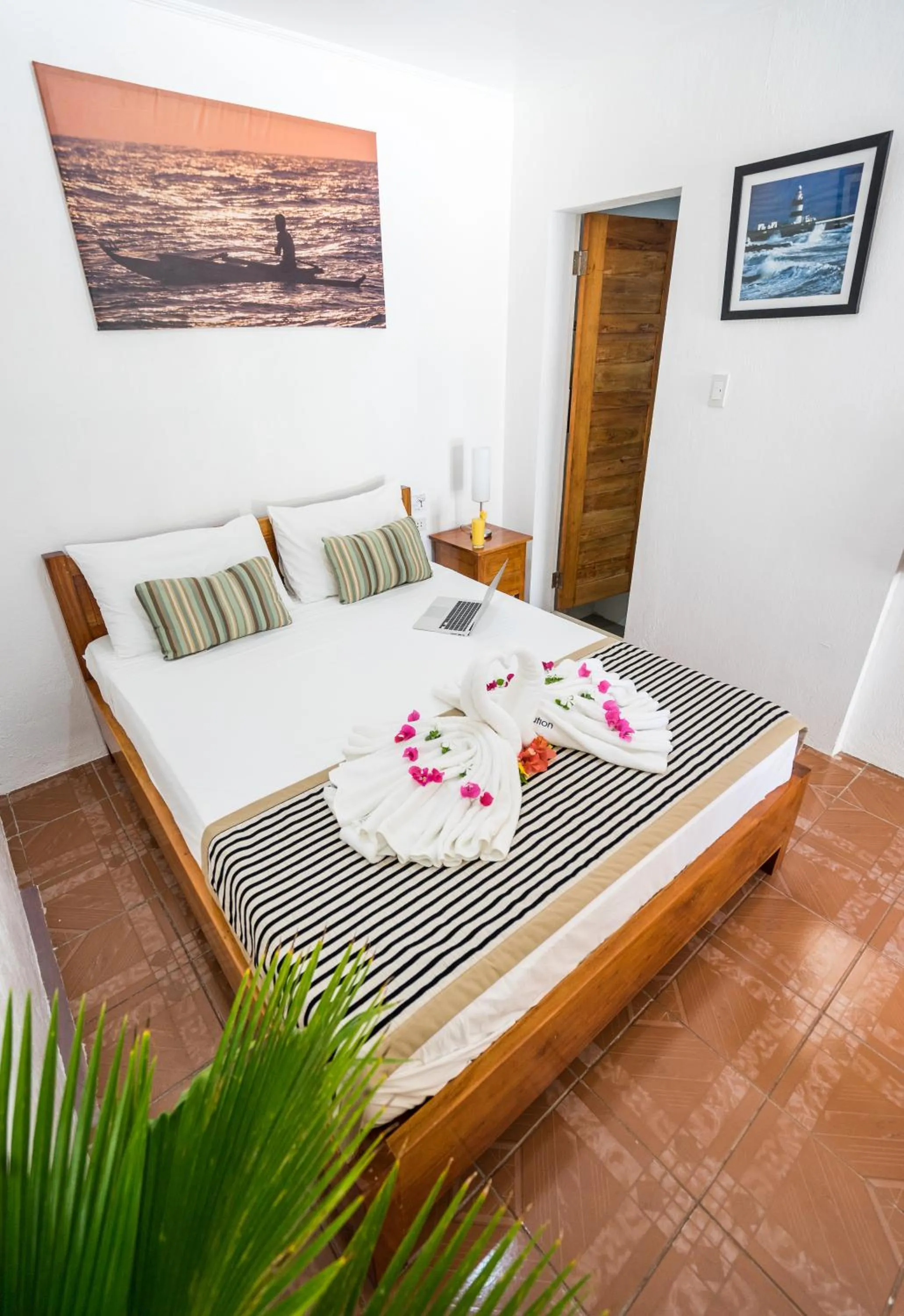 Bed in Evolution Dive and Beach Resort