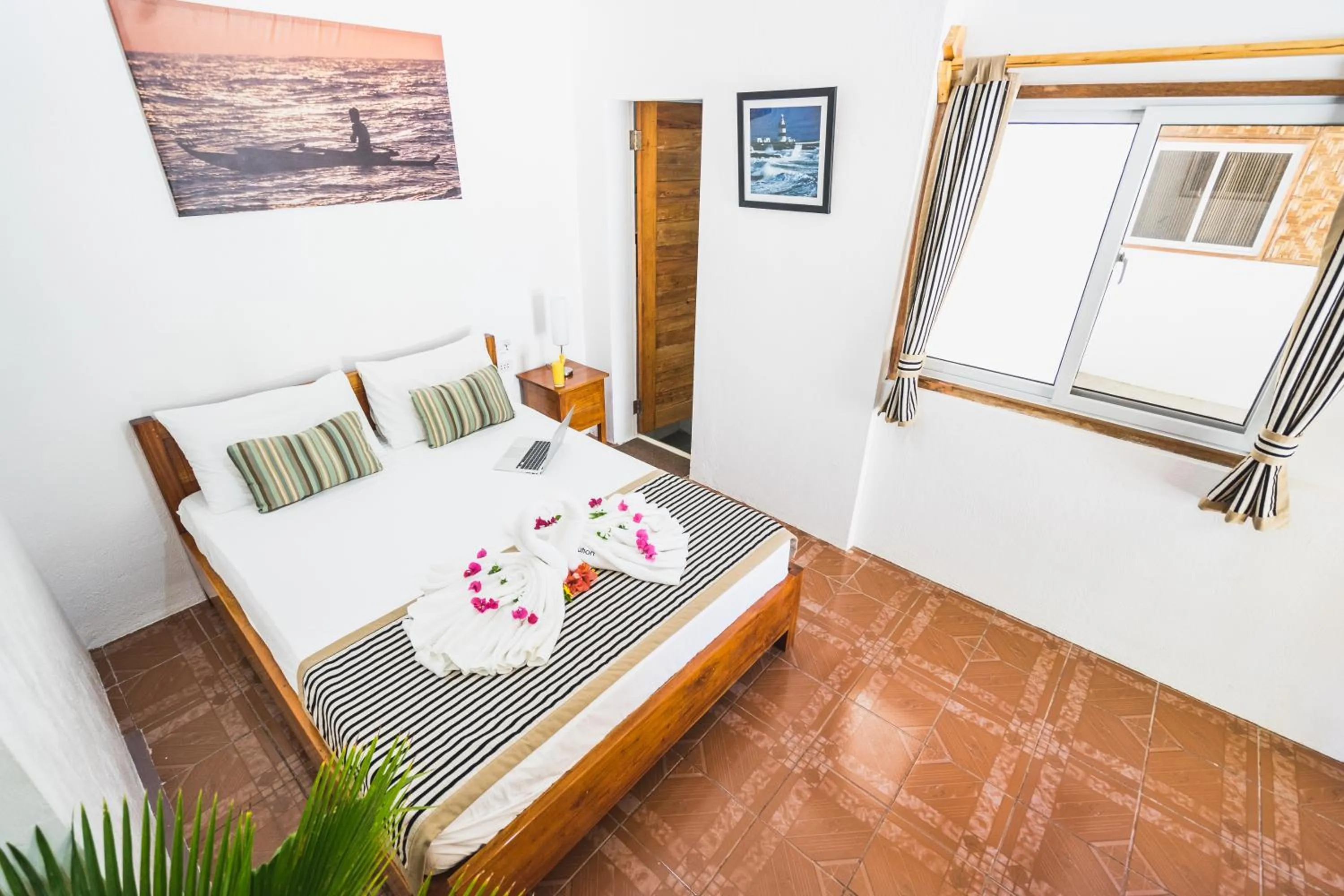 Bed in Evolution Dive and Beach Resort