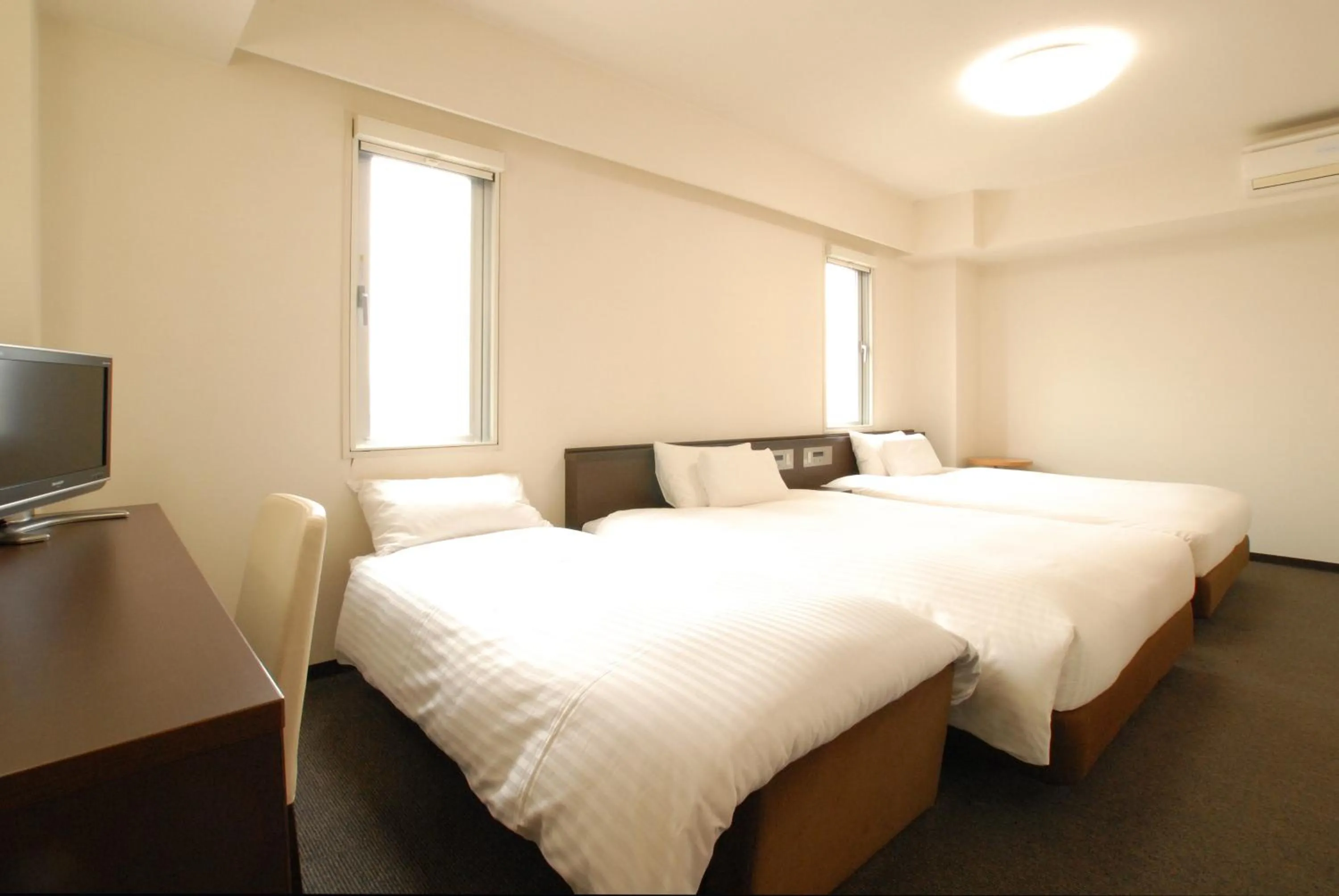 Bed in AB Hotel Okazaki