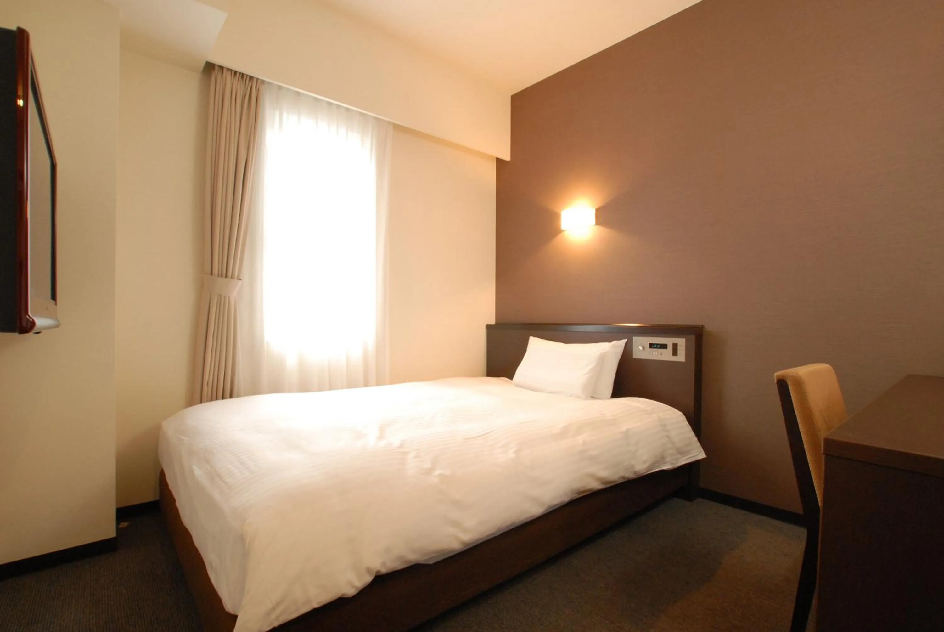 Bed in AB Hotel Okazaki