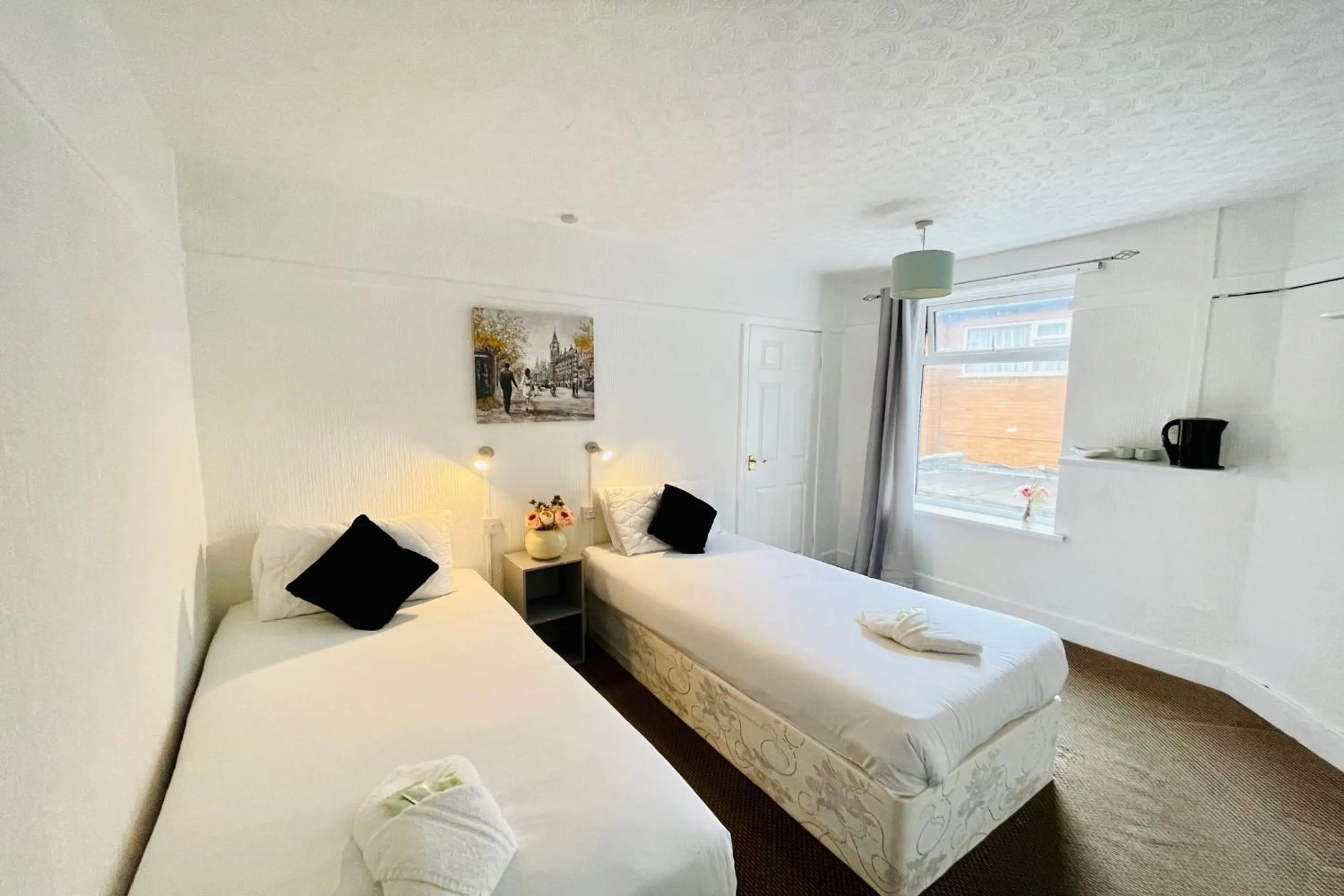 Bedroom in OYO The Sun Hotel