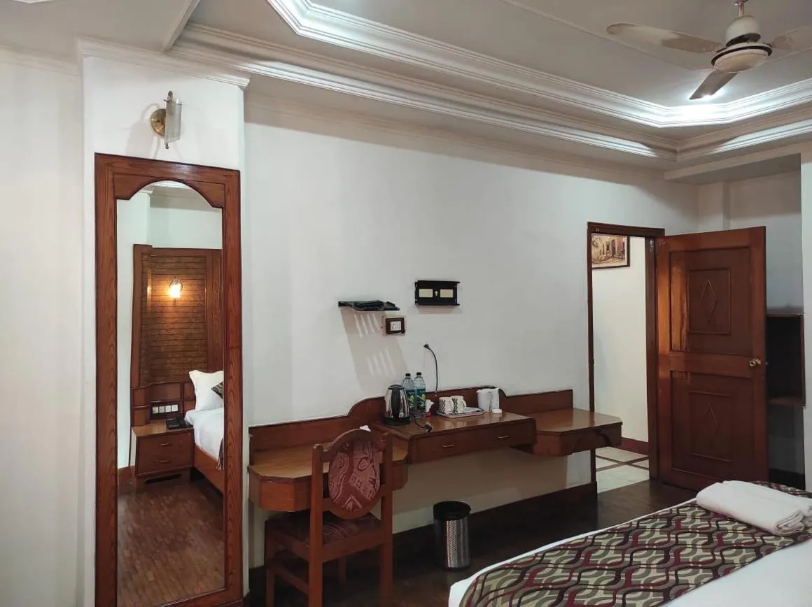 Bedroom in Hotel Ambarish Grand Residency