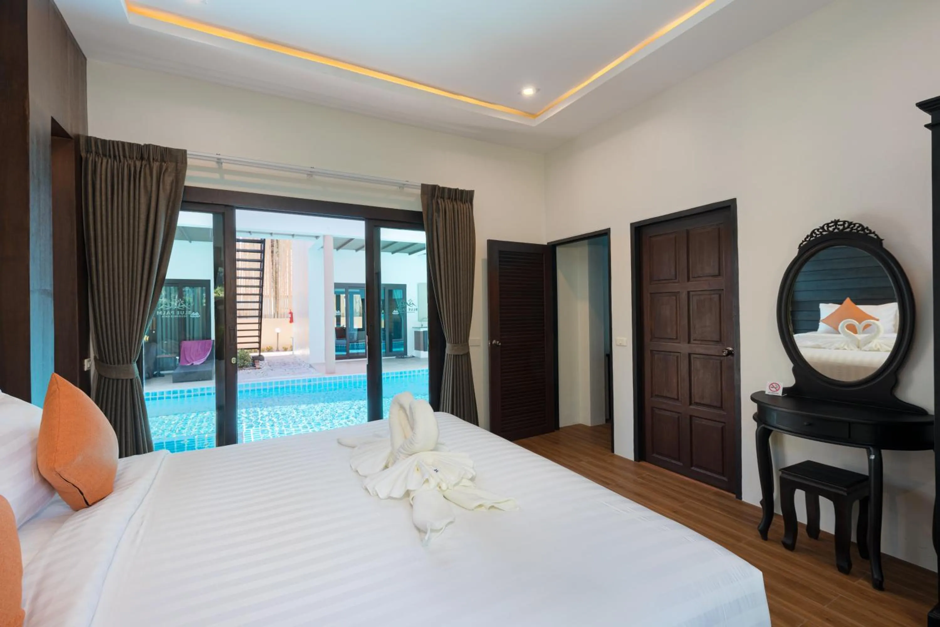 Pool view, Bed in Blue Palm Residence Kata
