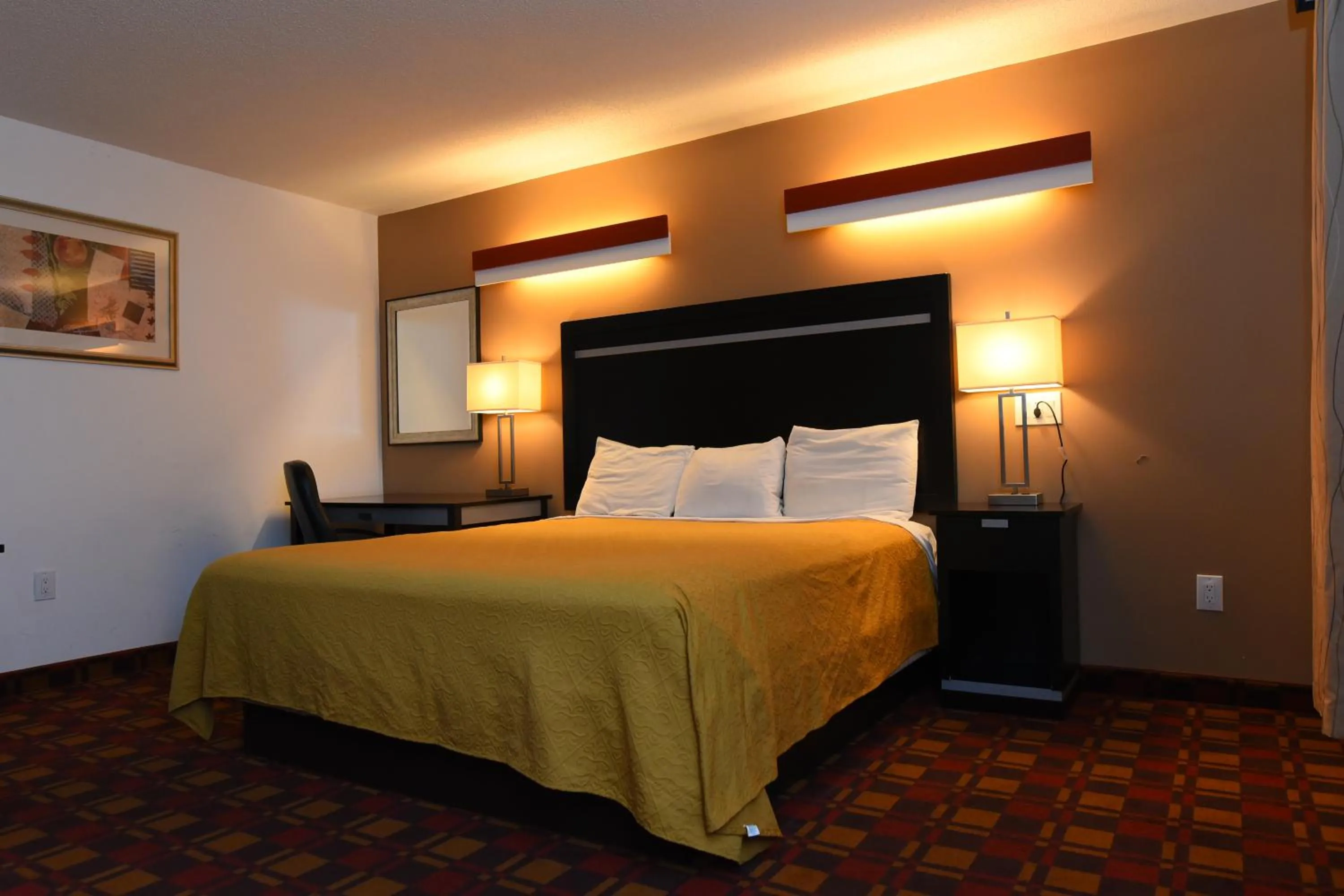 Bed in Capital Inn and Suites