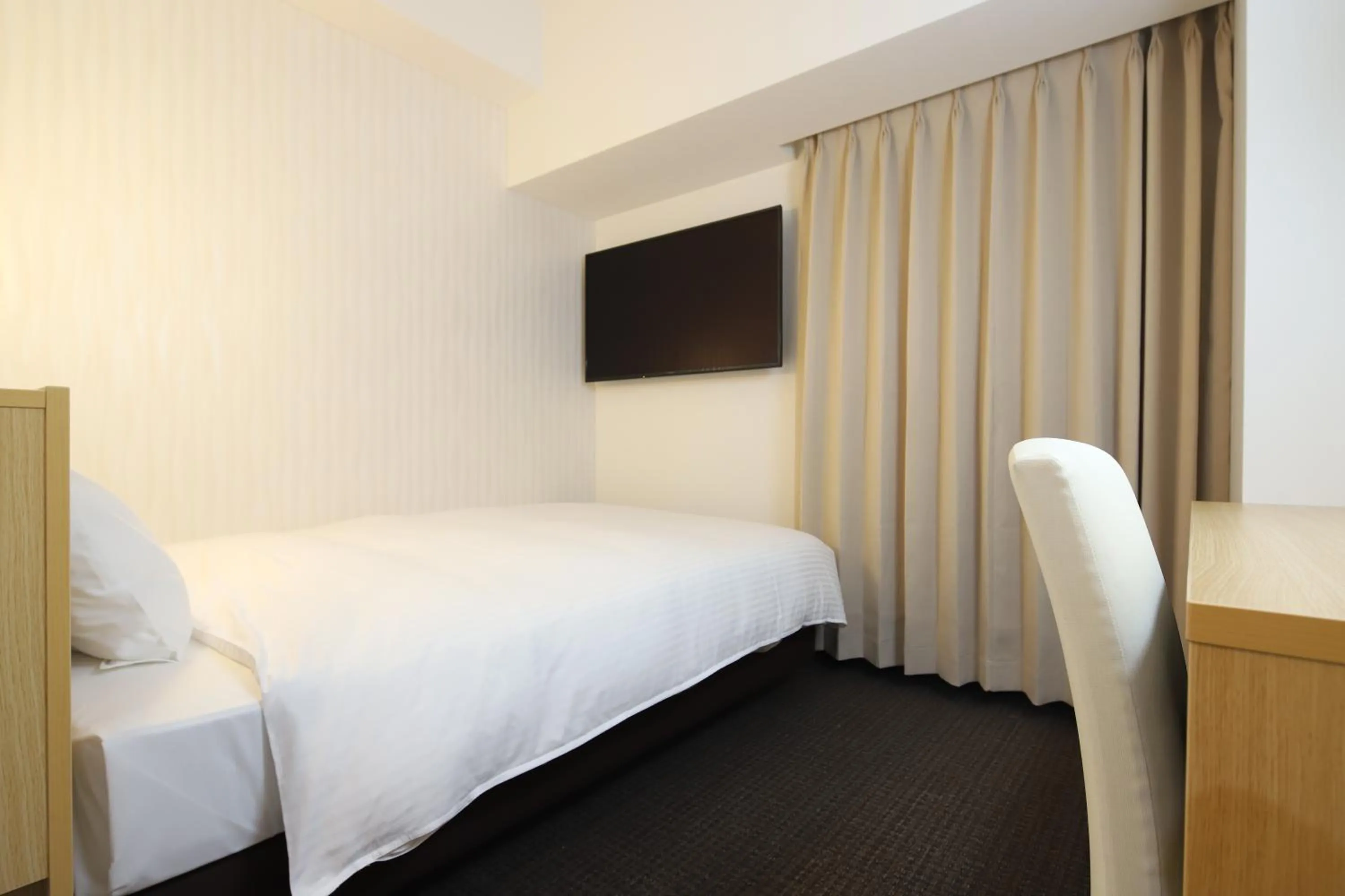 Bed in AB Hotel Kani