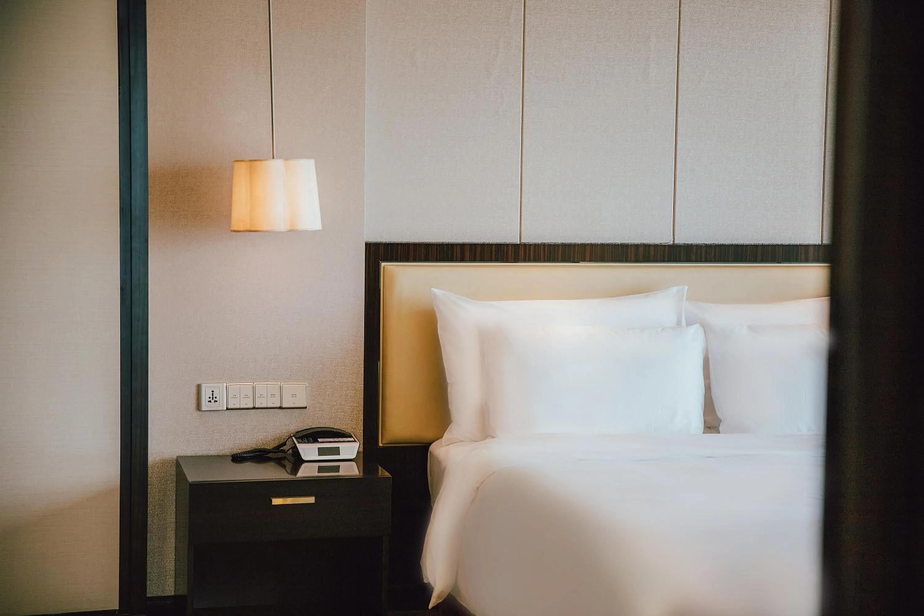 Bed in Junluxe Hotel Guangzhou Zengcheng