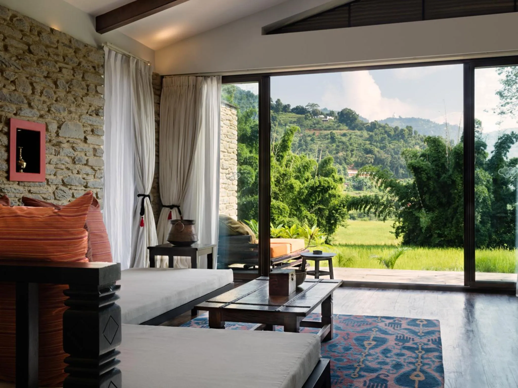 Living room, Bed in The Pavilions Himalayas The Farm