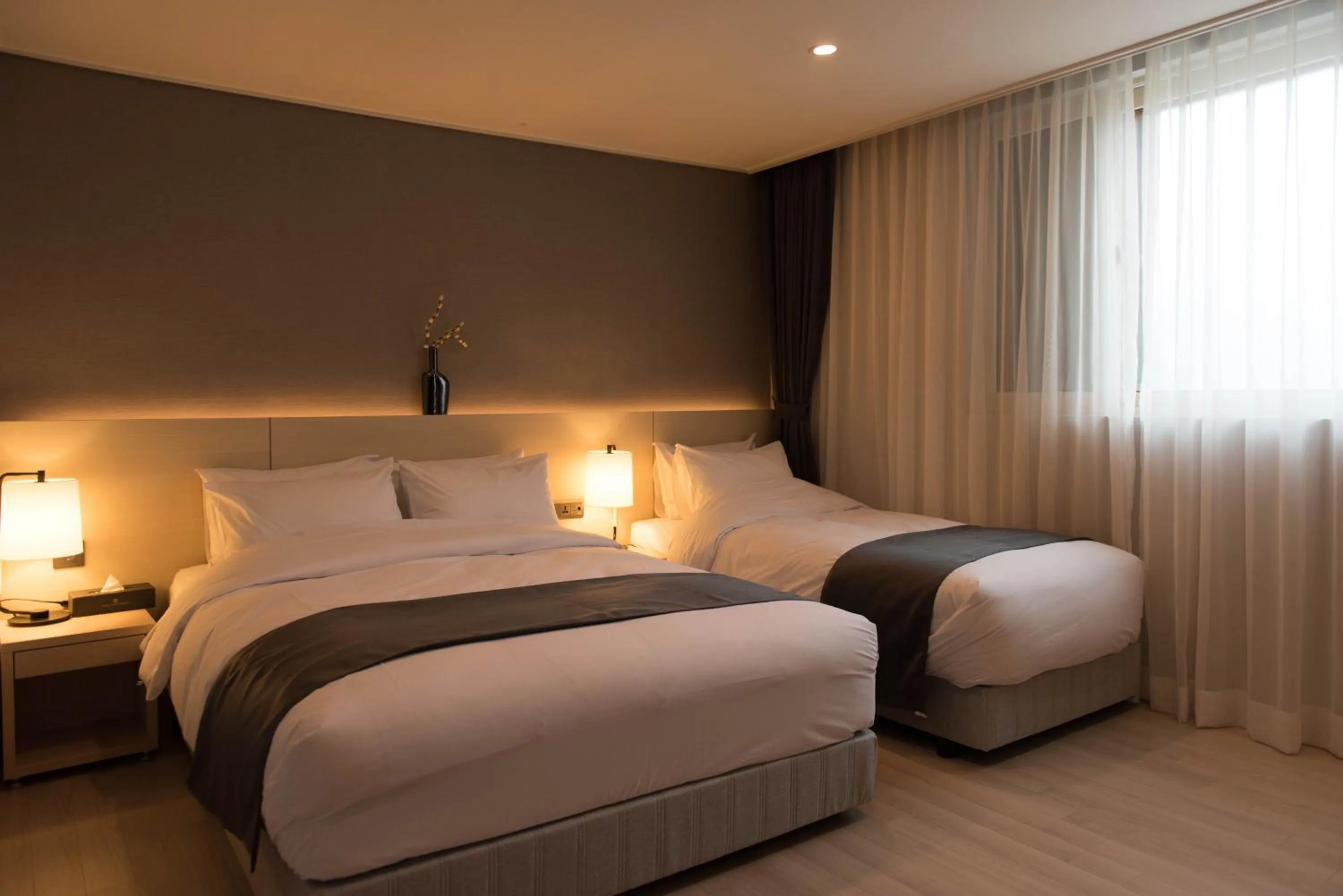 Bed in New Donghae Tourist Hotel