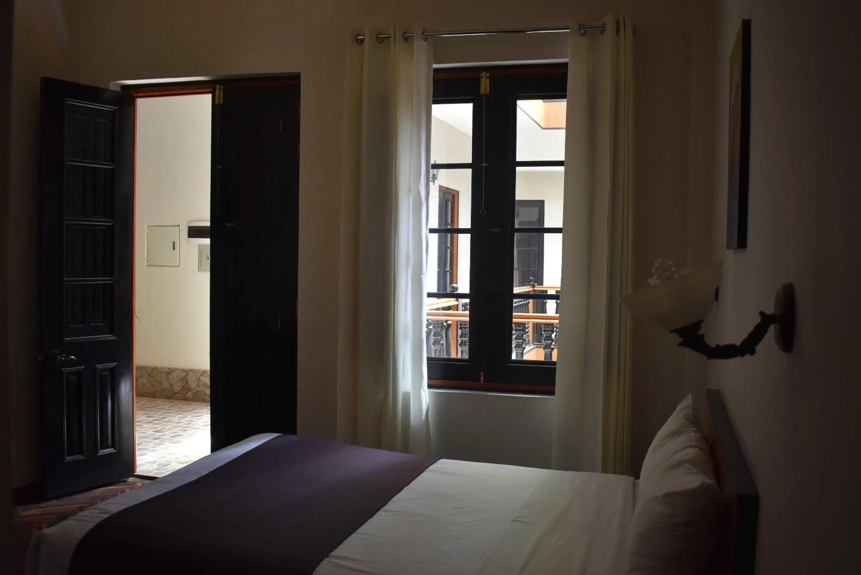 Bed in Colonial Plaza Hotel