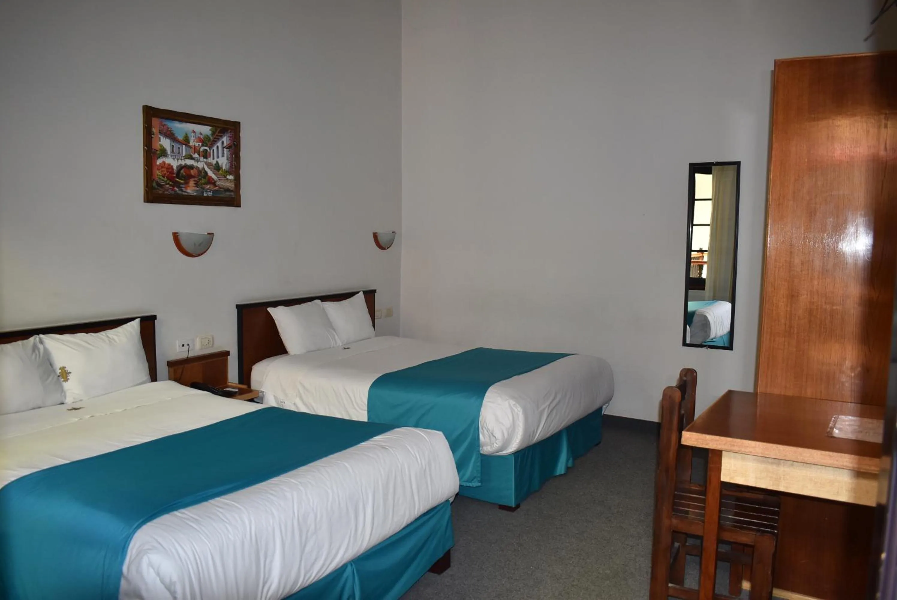 Bed in Colonial Plaza Hotel