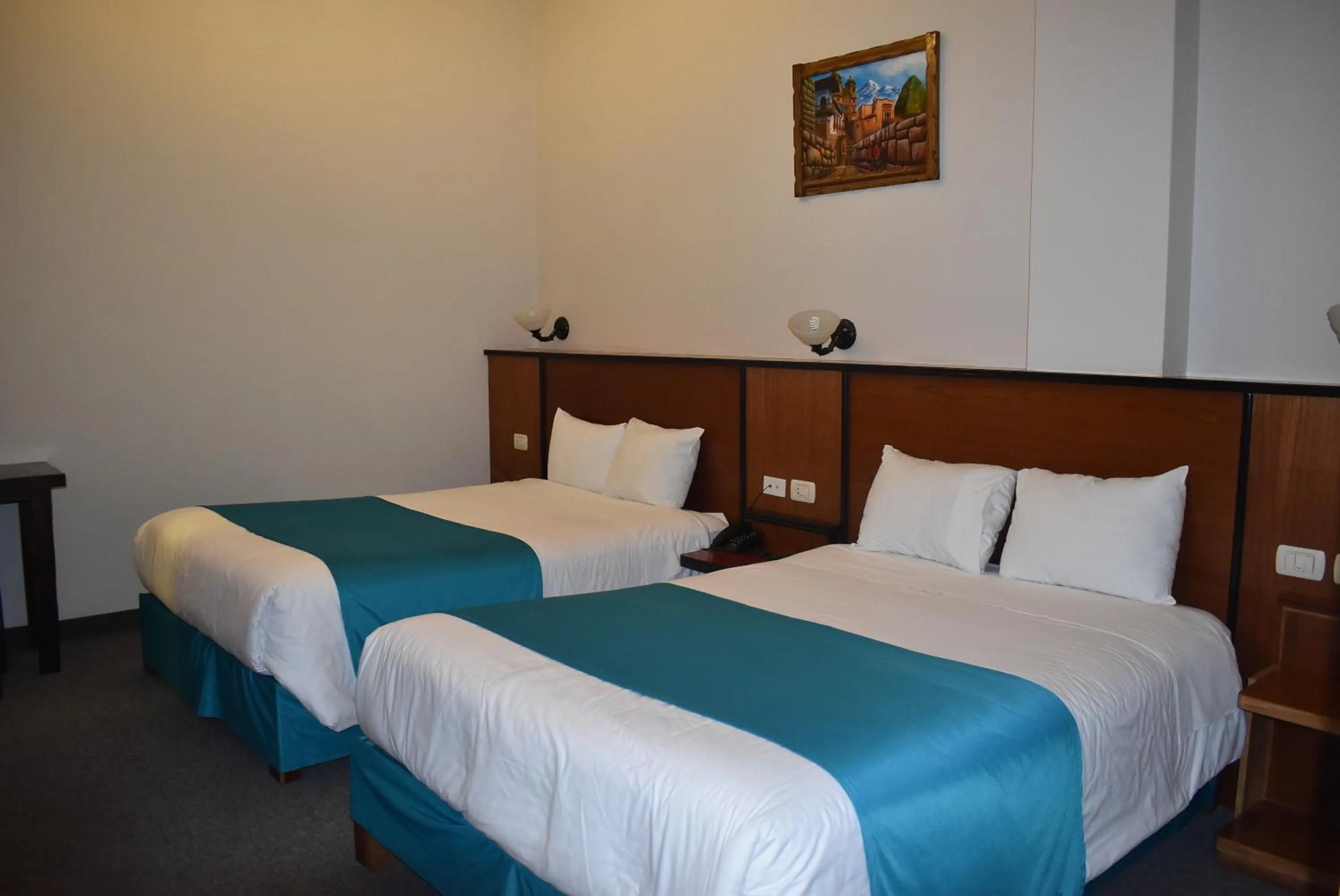 Bed in Colonial Plaza Hotel