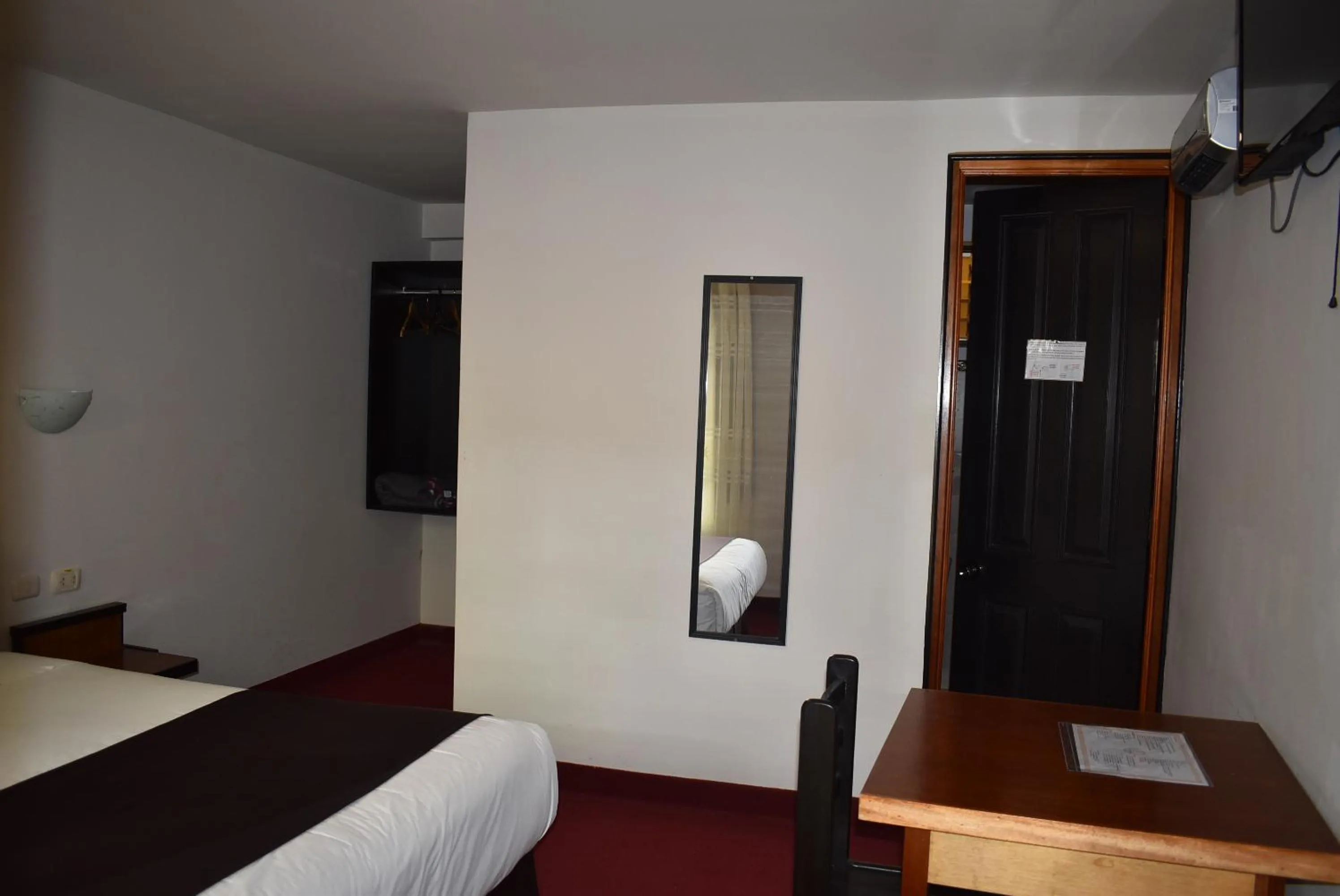 Bed in Colonial Plaza Hotel