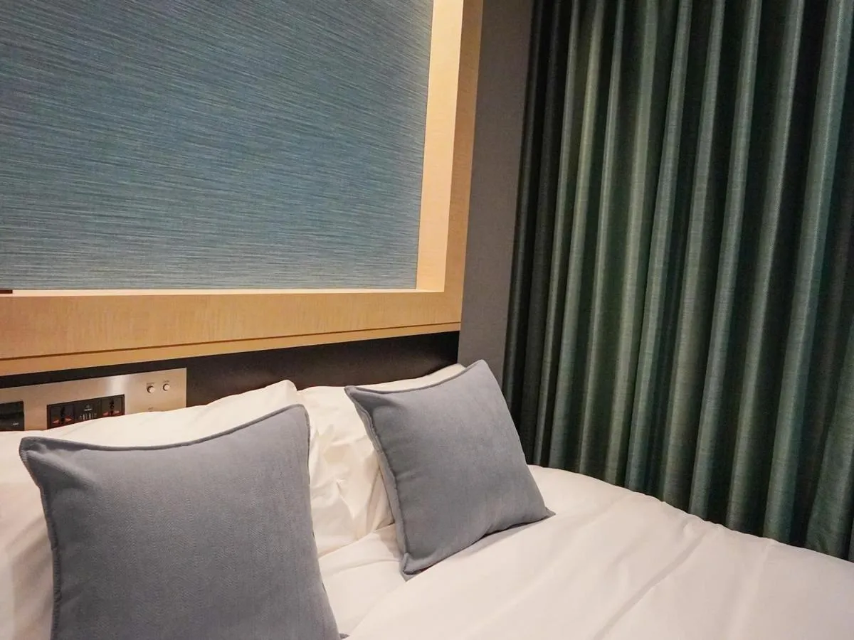 Bed in The GALA Hotel Umeda