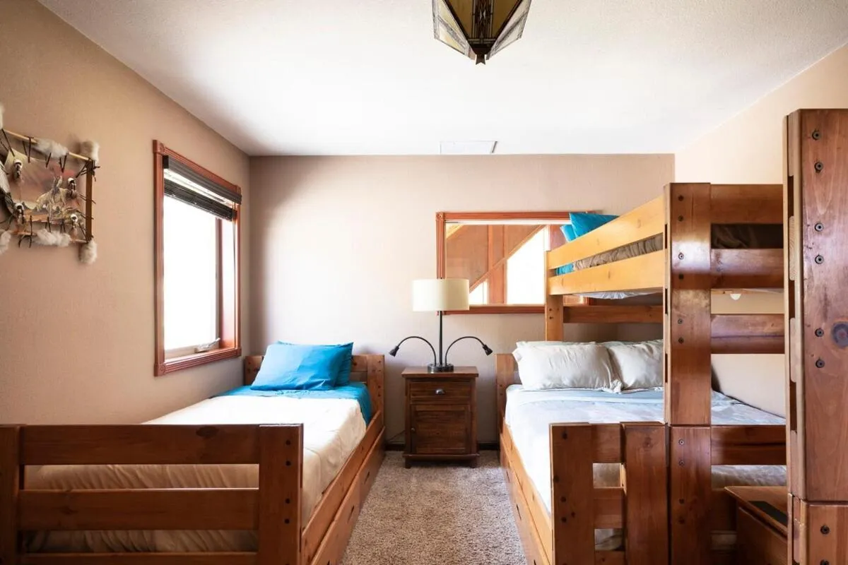 Bed in Waterfall Lodge near Yosemite Endless Pool, Hot Tub, Playground