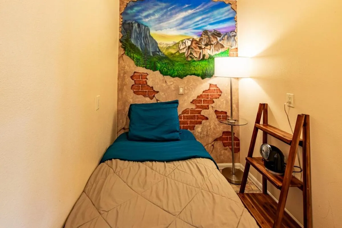 Bed in Waterfall Lodge near Yosemite Endless Pool, Hot Tub, Playground