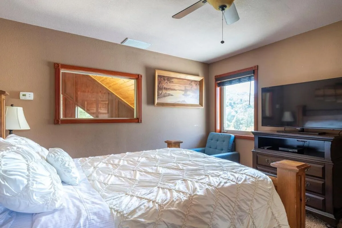 Bed in Waterfall Lodge near Yosemite Endless Pool, Hot Tub, Playground