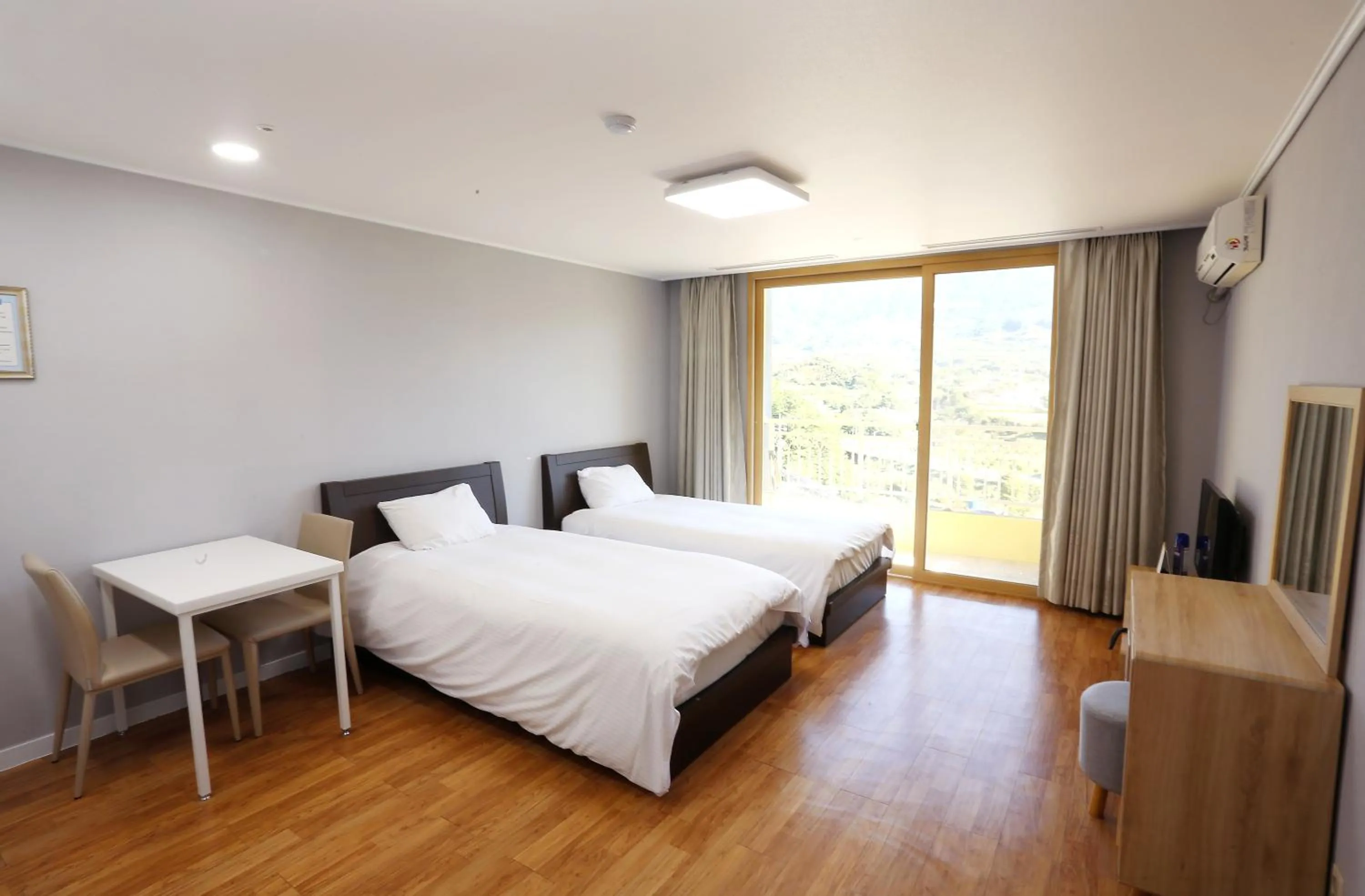 Bed in The K Jirisan Family Hotel