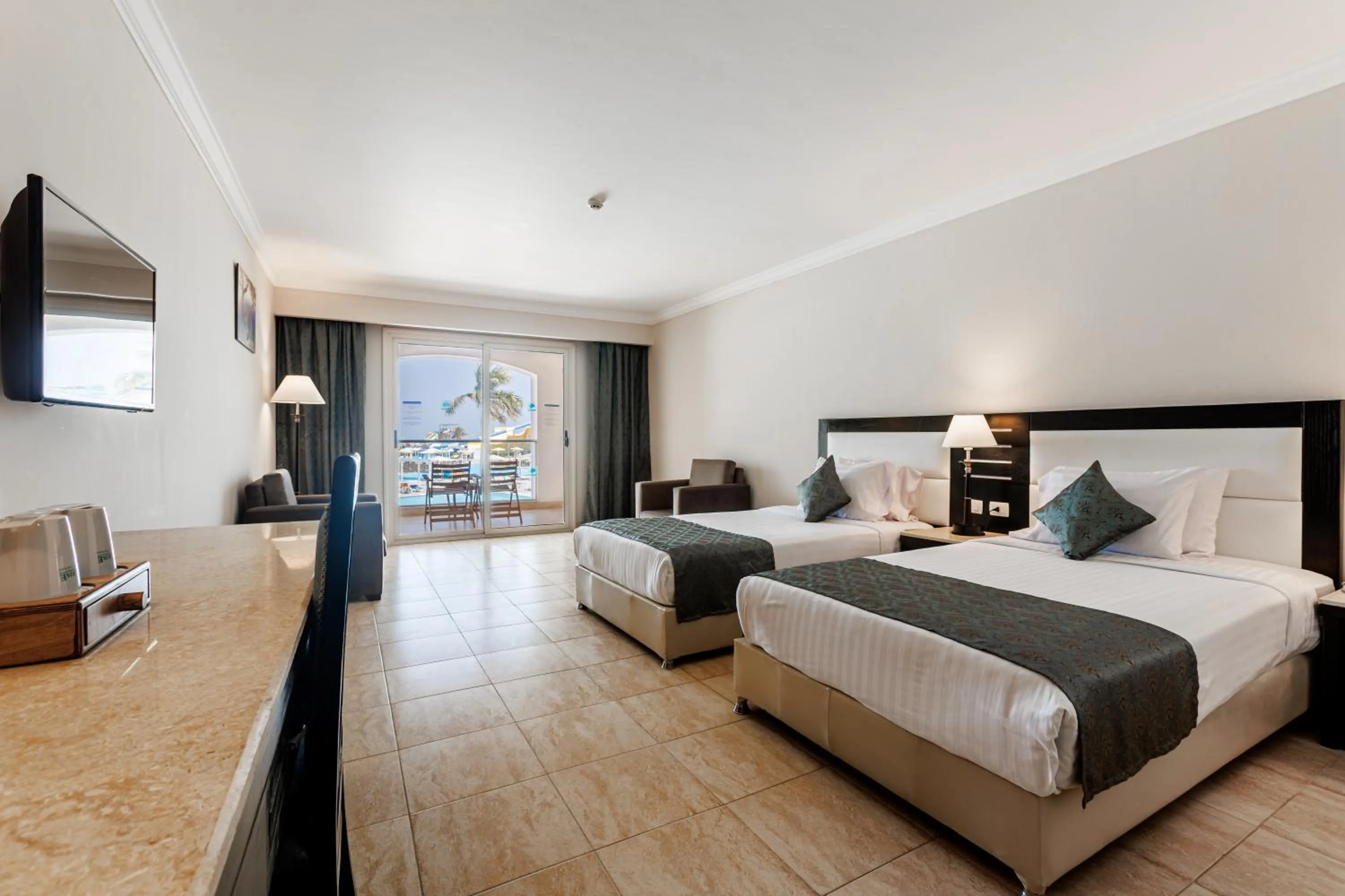 Bed in Sunrise Alora Aqua Park Resort